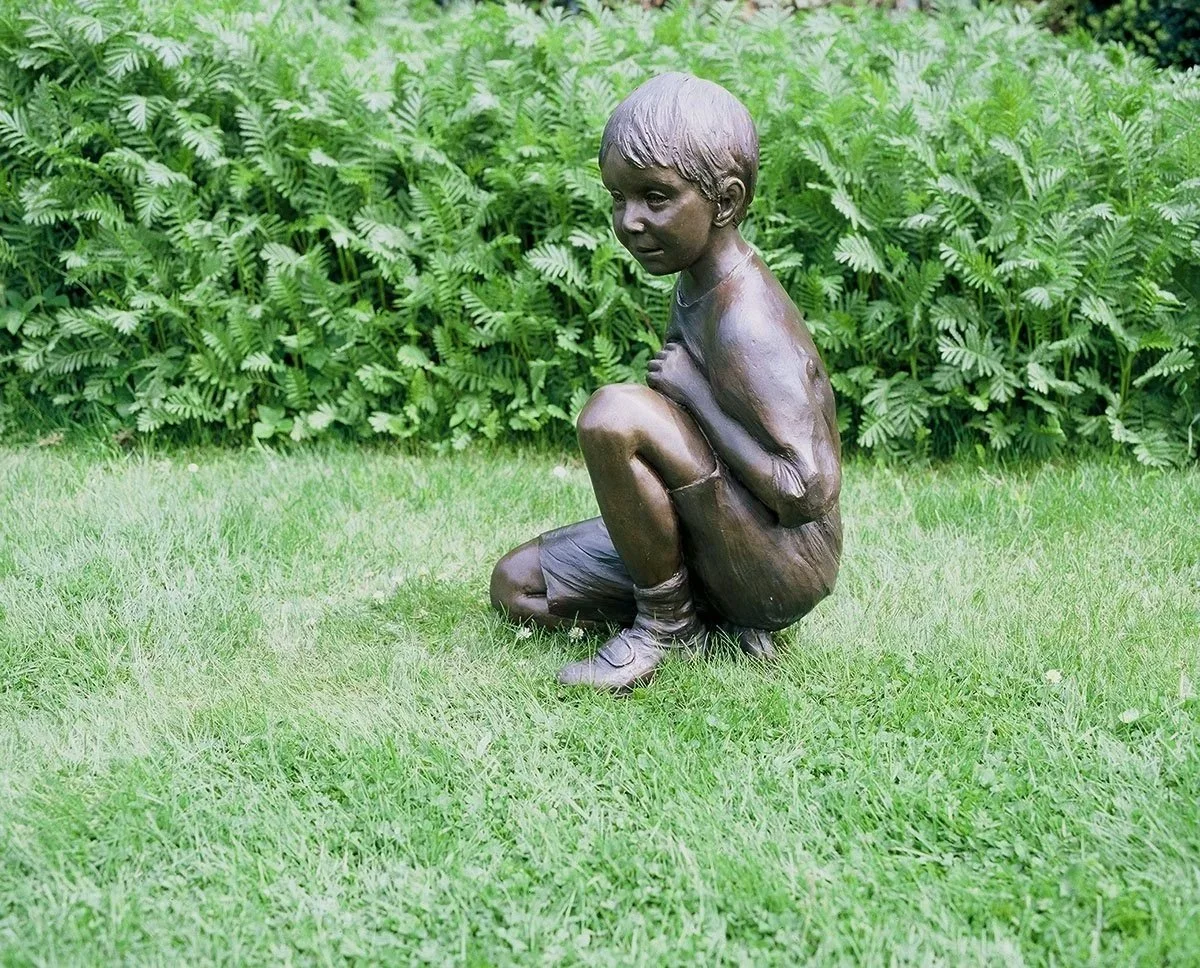Child Kneeling Life-Size Sculpture by Judith Holmes Drewry.jpg