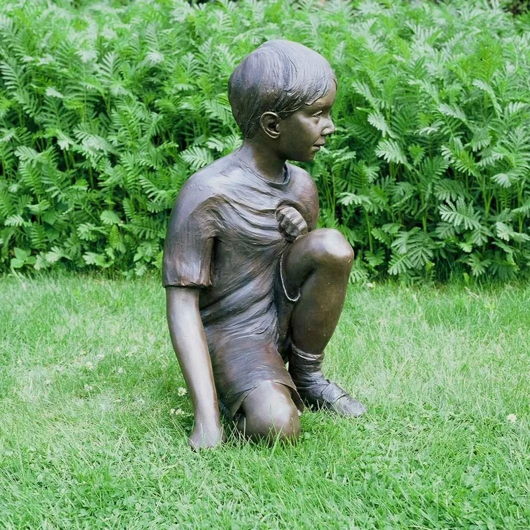 Child Kneeling Life-Size Sculpture by Judith Holmes Drewry.jpg