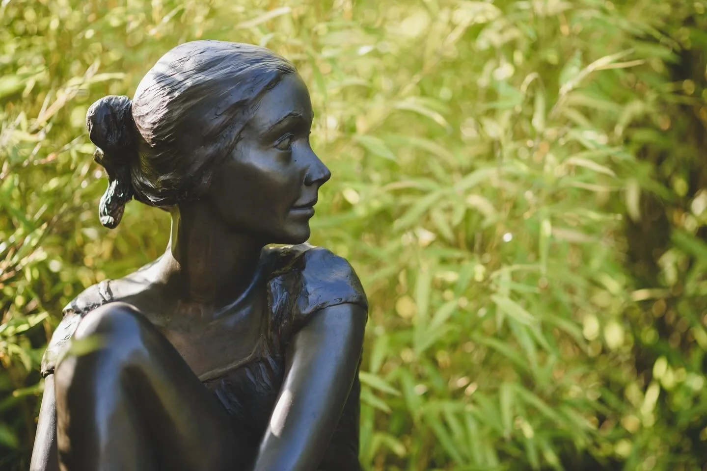 Sophie in our bamboo garden by Judith Holmes Drewry basking in the spring sunshine. 

#figurativesculpture 
#judithholmesdrewry
#gardensculpture