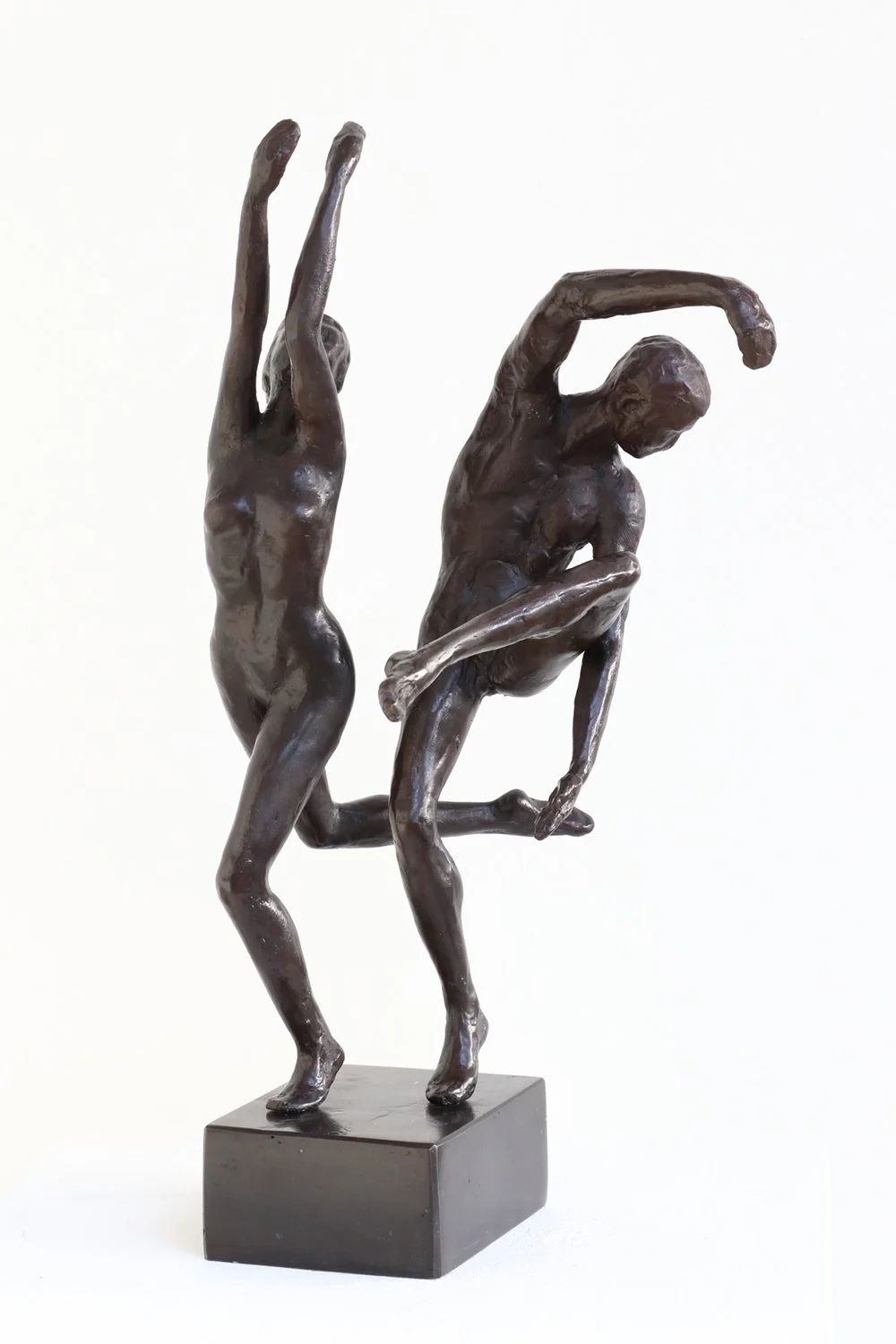 Study in Movement Female II & Male IV small bronze sculpture female figure arms raised leg lifted behind male figure leg raised one arm arched over head dancers depicted moving in harmony