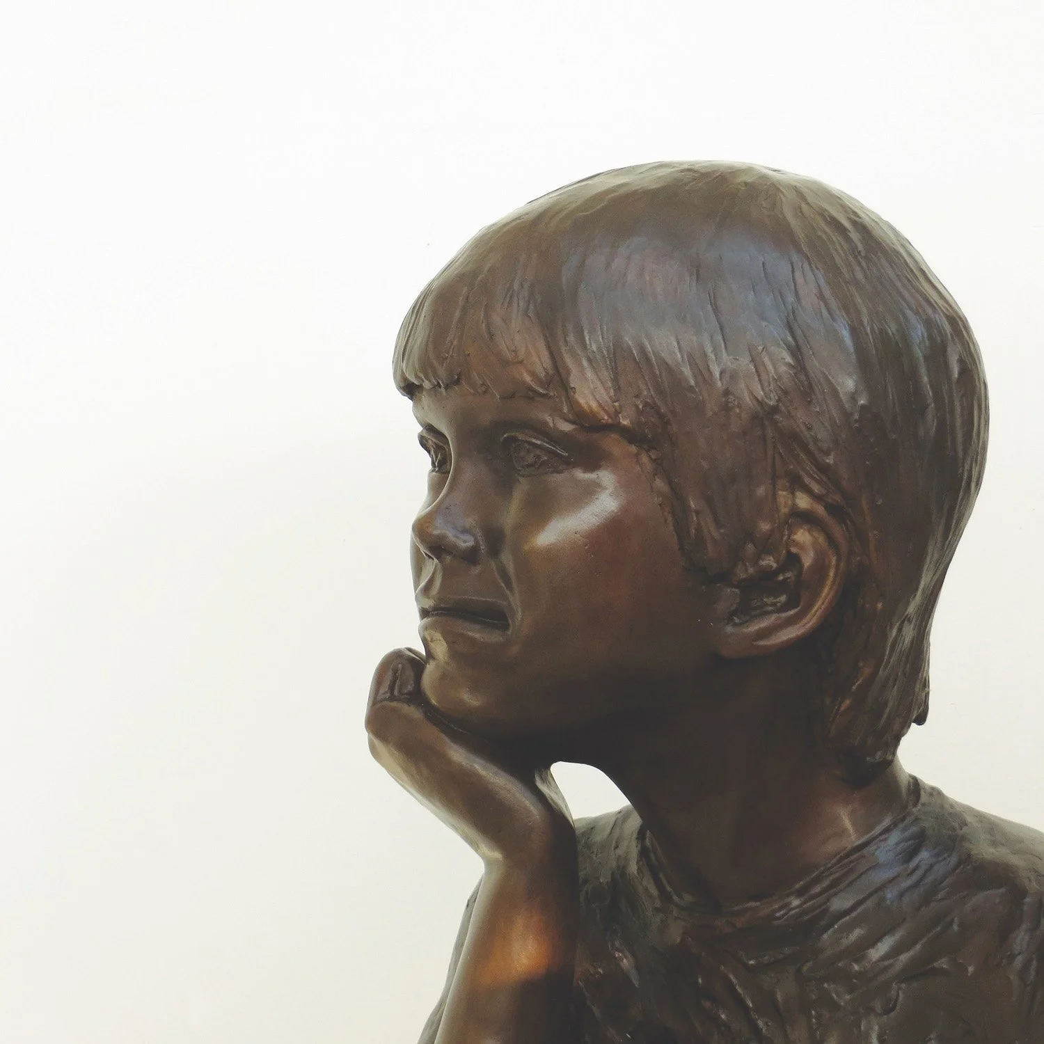bronze-sculpture-boy-sitting-crossed-legged-v2.jpg