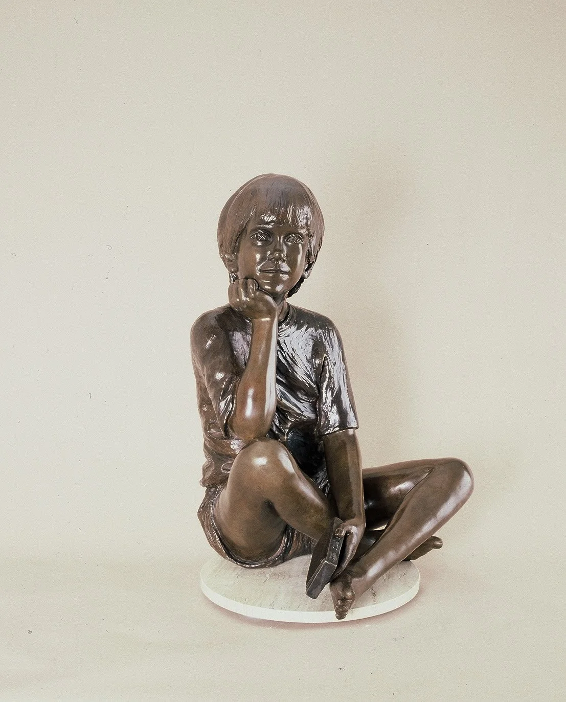 bronze-sculpture-boy-sitting-crossed-legged-v3.jpg