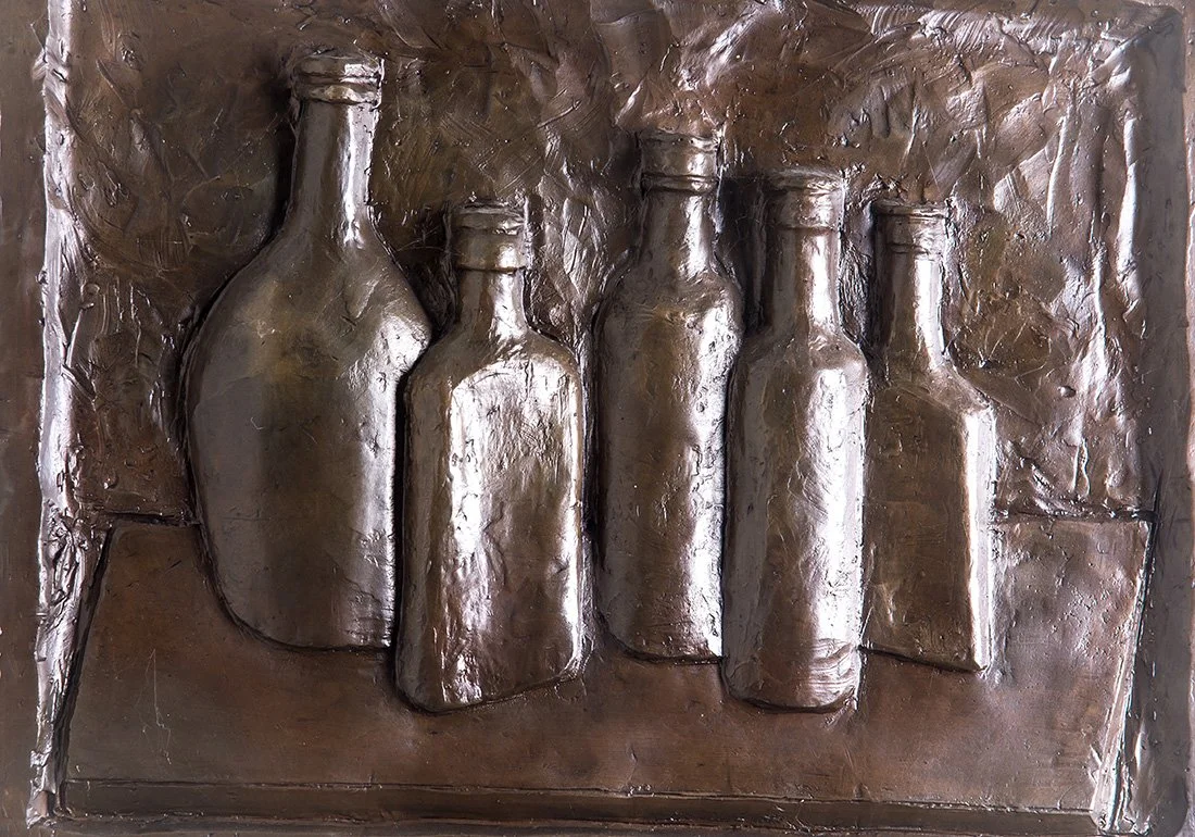 Still Life Relief I bronze relief sculpture of bottles close up view