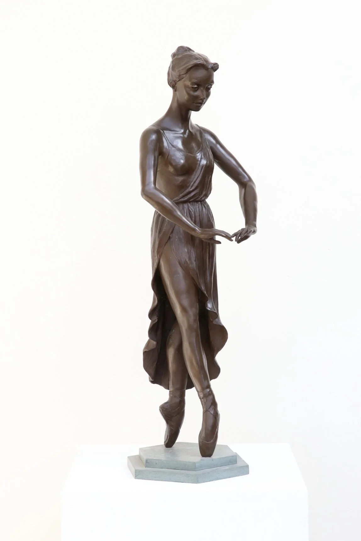 Half life size bronze sculpture ballerina on pointe flowing dress detail