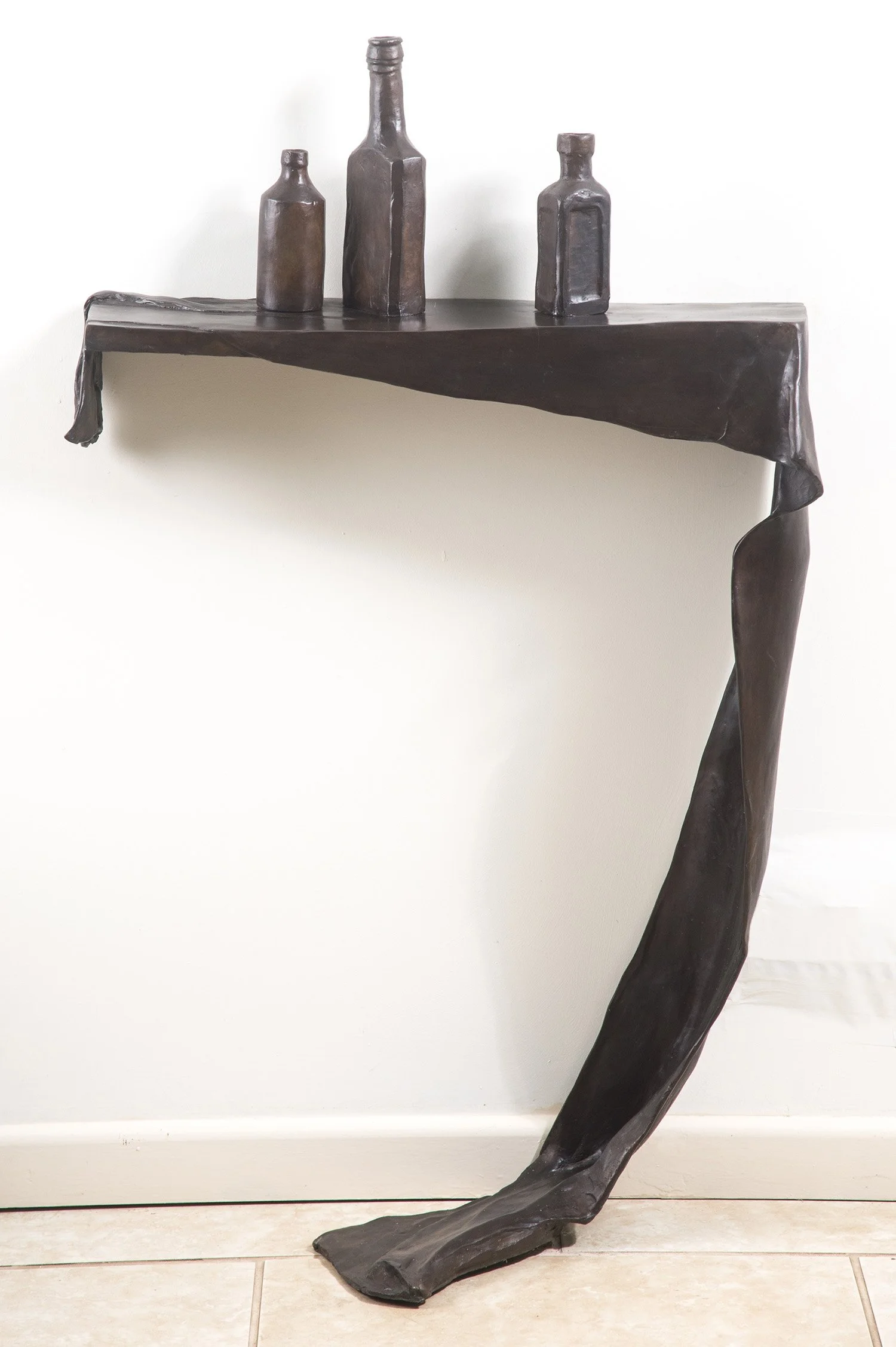 Still Life VIII life size bronze sculpture draped cloth and bottles on shelf