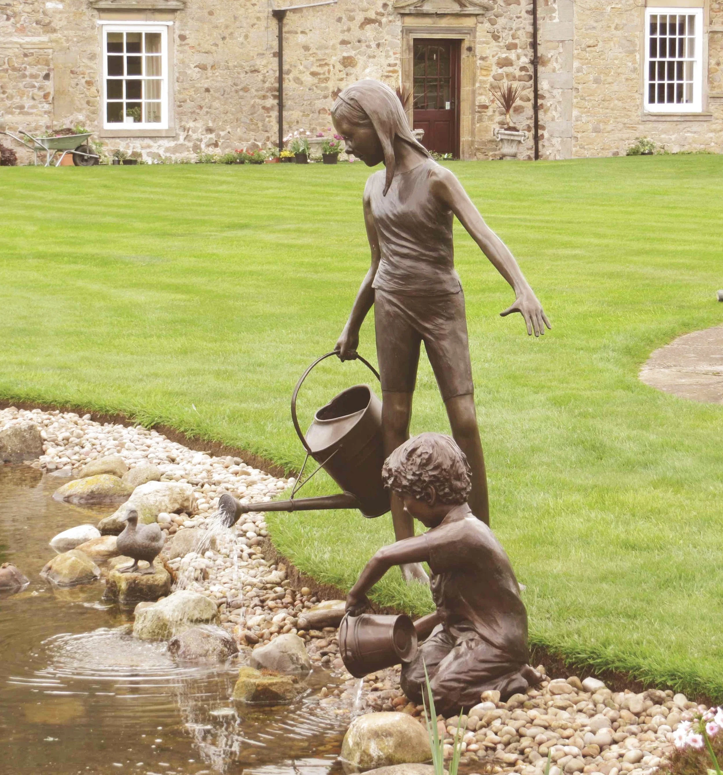 Life-Size Children Figure Sculptures by Judith Holmes Drewry.jpg