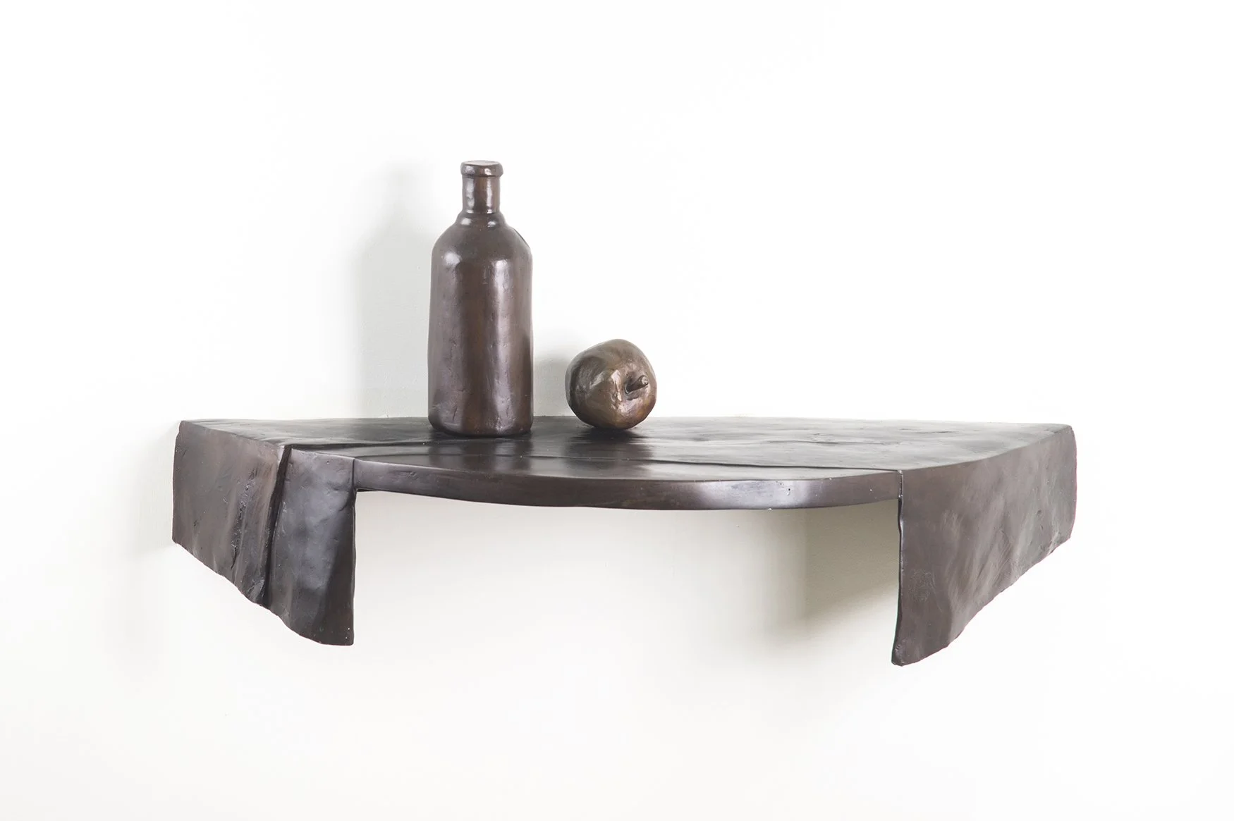 Still Life II life size bronze sculpture semi circular shelf with cloth bottle and apple front view