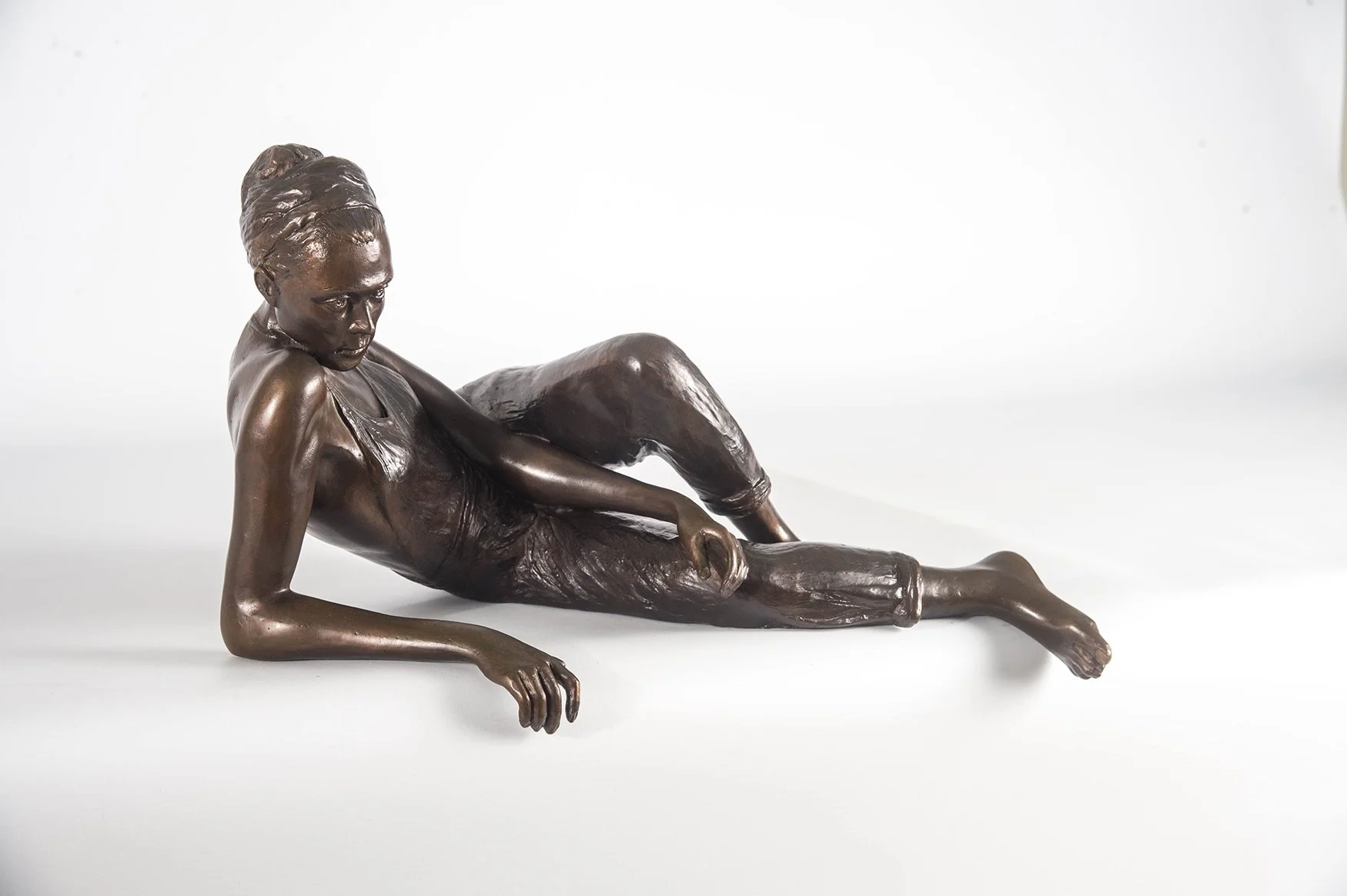 Young Woman Reclining Study small bronze sculpture of female figure reclining