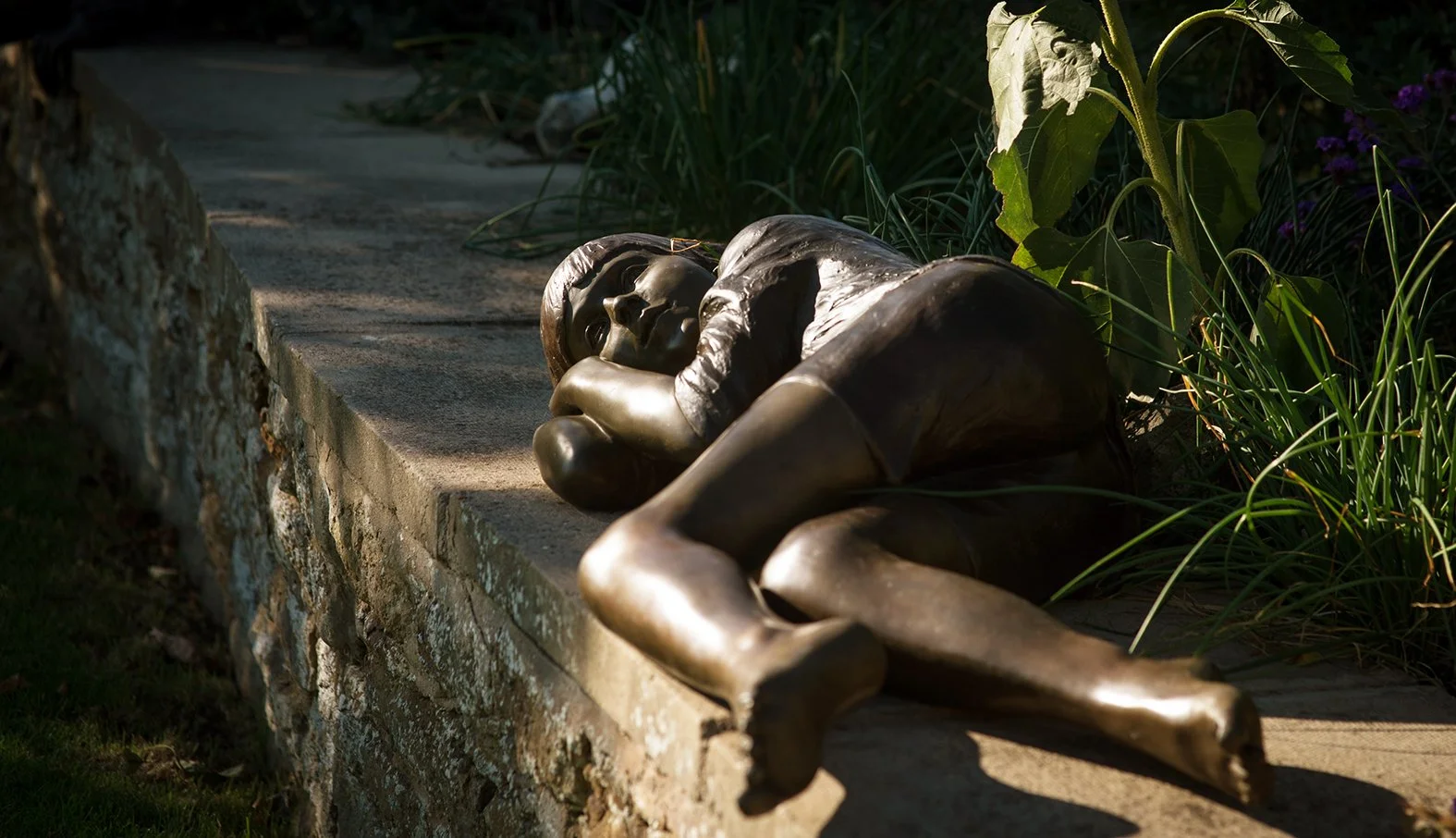 Resting Child Life-Size Sculpture by Judith Holmes Drewry.jpg