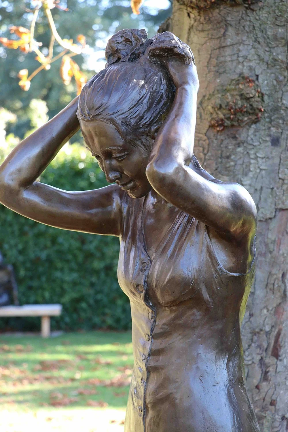 bronze-sculpture-young-woman-putting-up-her-hair-v1.jpg