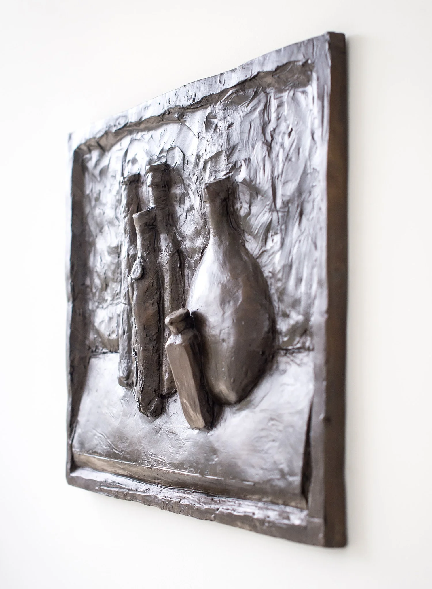 Still Life Relief II life size bronze relief sculpture of bottles side view