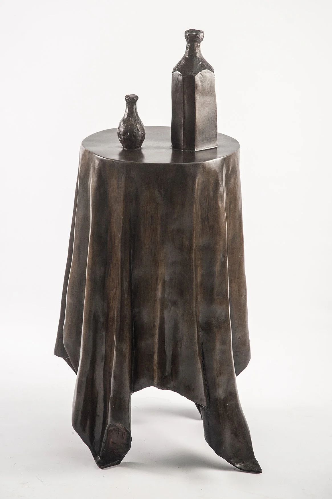 Still Life VI life size bronze sculpture of  circular table tablecloth and bottles