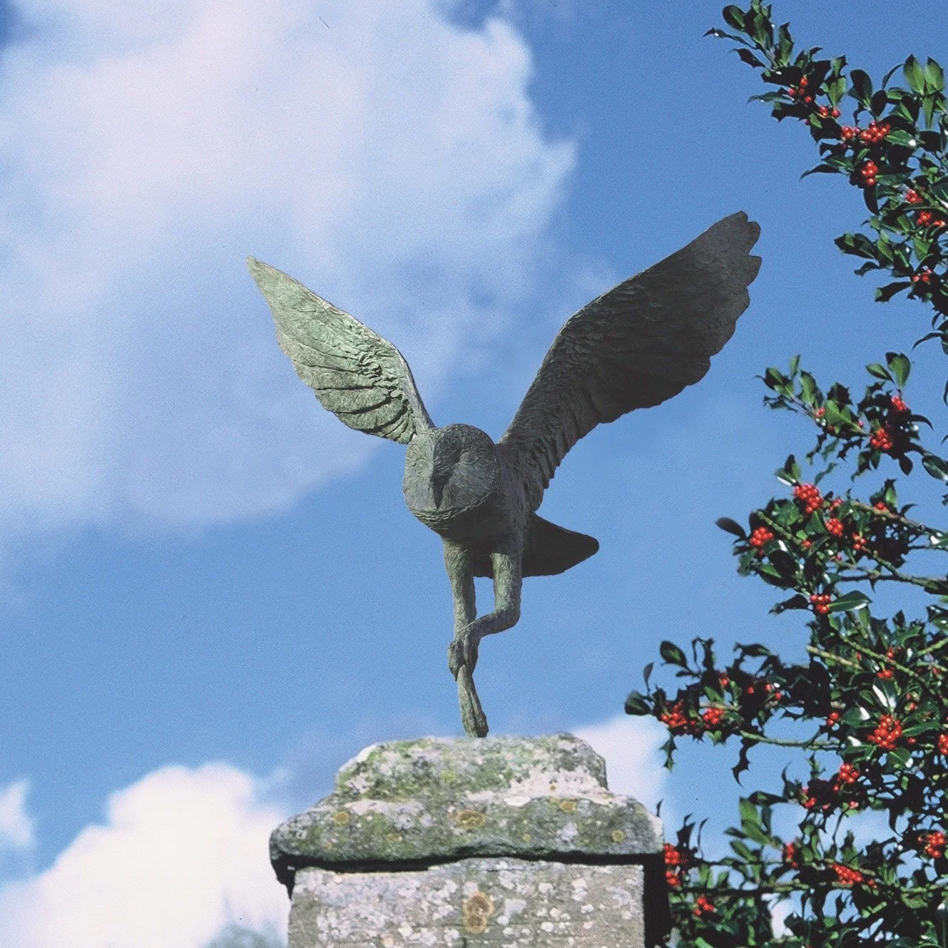 Barn owl in flight bronze sculpture