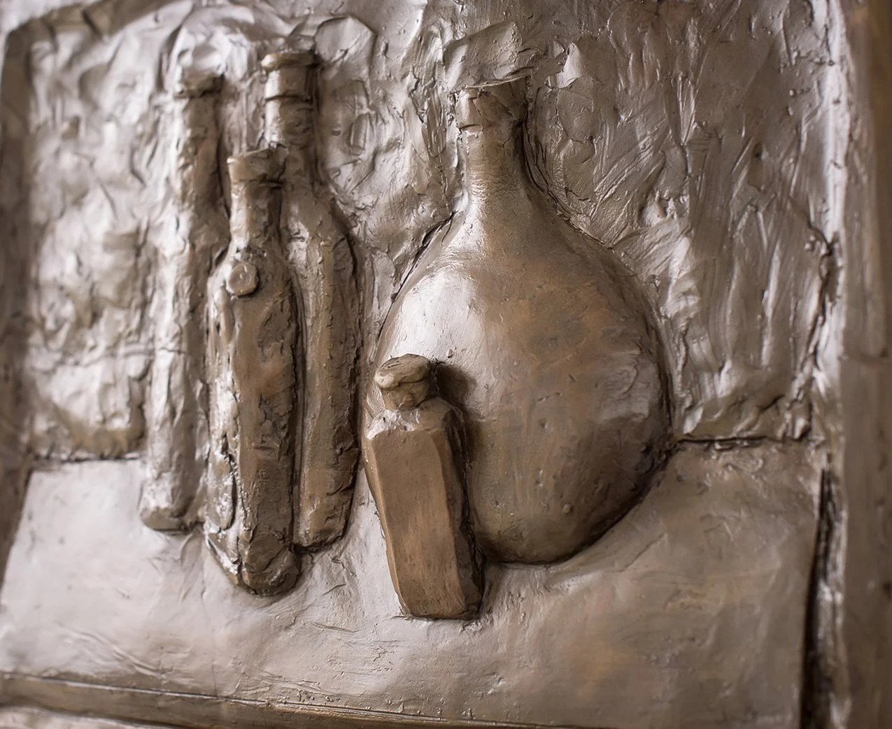 Still Life Relief II life size bronze relief sculpture of bottles close up view