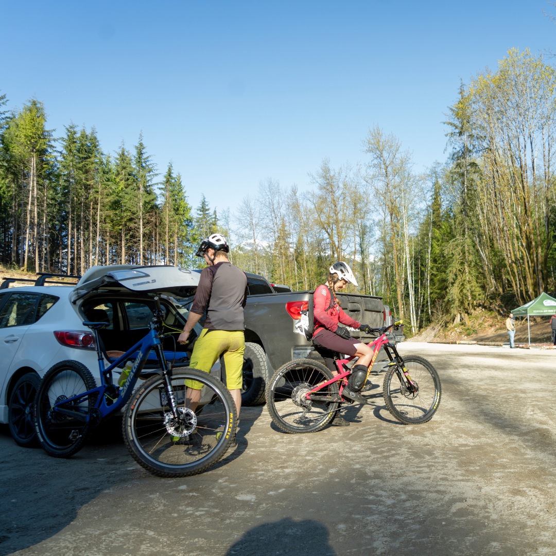 Mountain bikers in the pseudo parking lot in Squamish.png