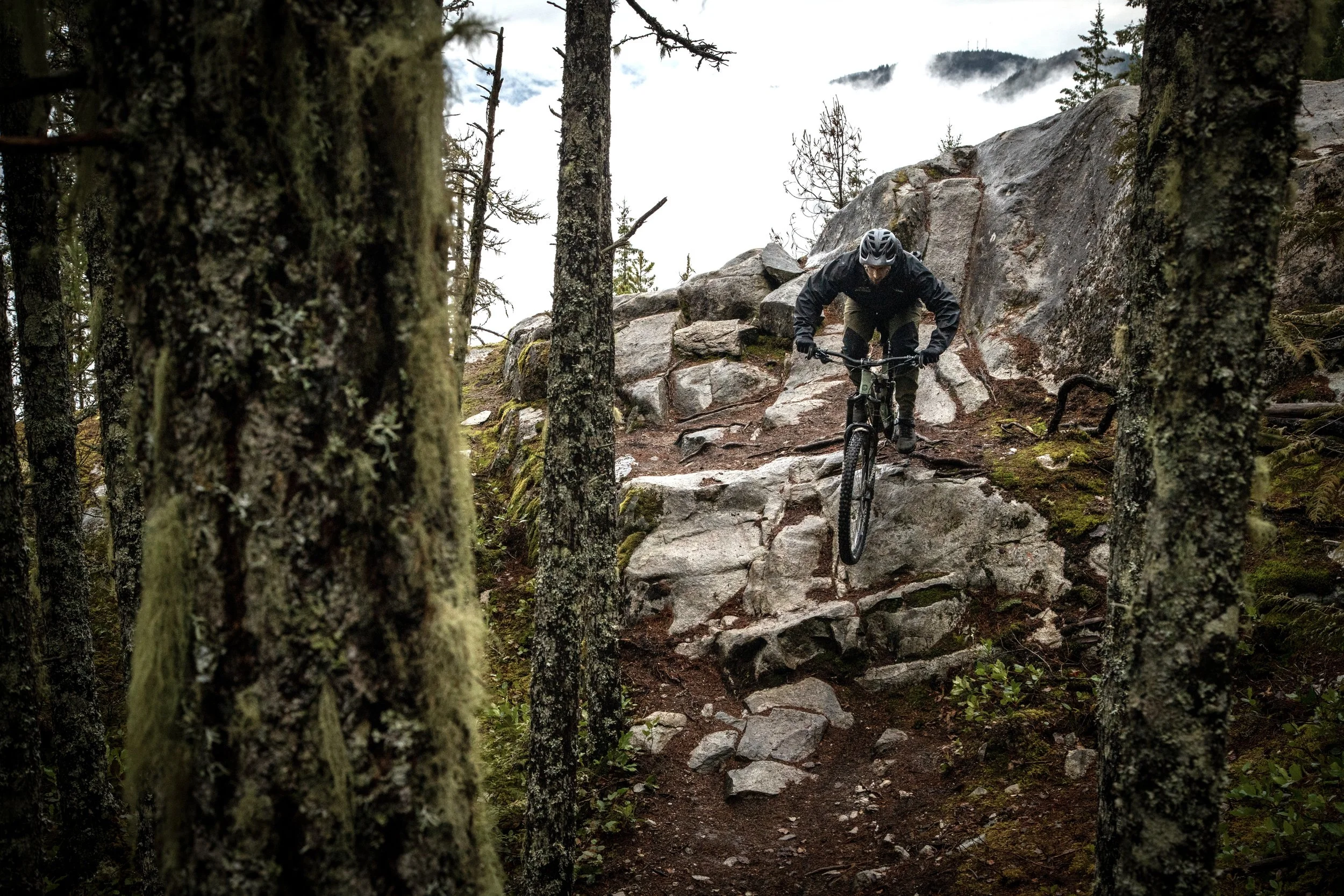 A mountain biker rides a slab in Squamish, BC