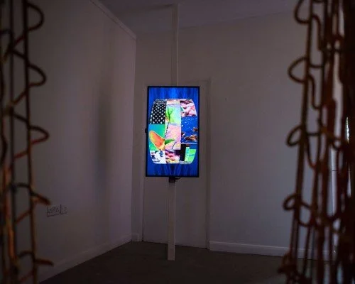 Install shot of 'Entering the Machine Zone' (2017) Katriona Beales, shown as part of 'Are We All Addicts Now?' at Furtherfield 2017. Interactive moving image with motion sensors and bespoke seating. Pic by Pau Ros.