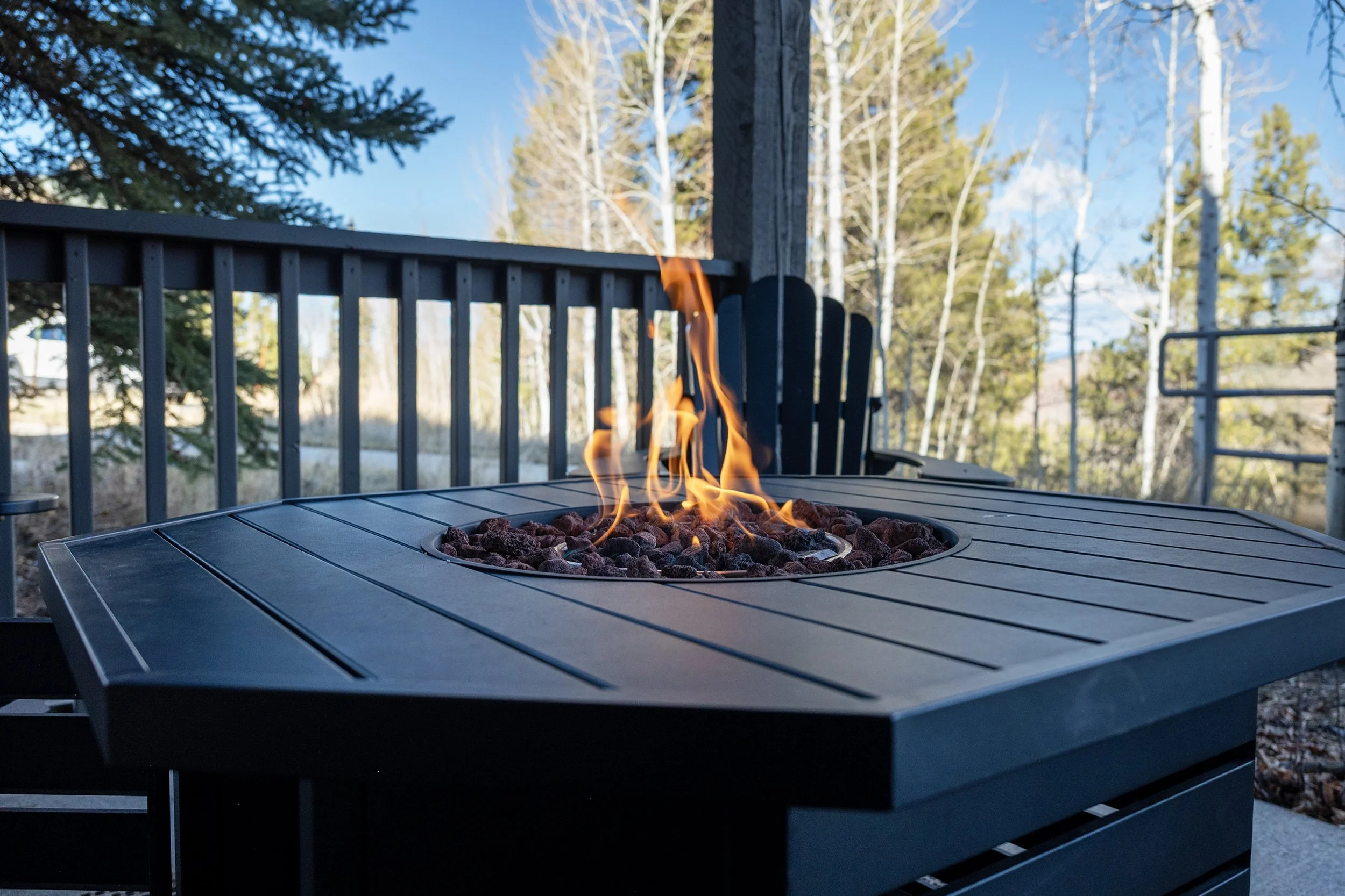 Cozy outdoor fire table on your private patio - unwind with mountain views and crisp Colorado air.