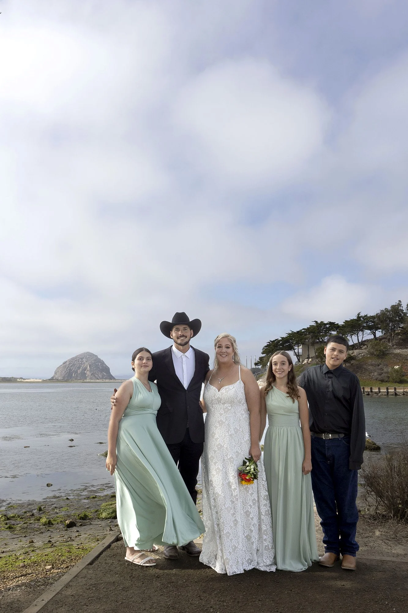 Blended family wedding photos with three kids at Morro Bay State Park boardwalk
