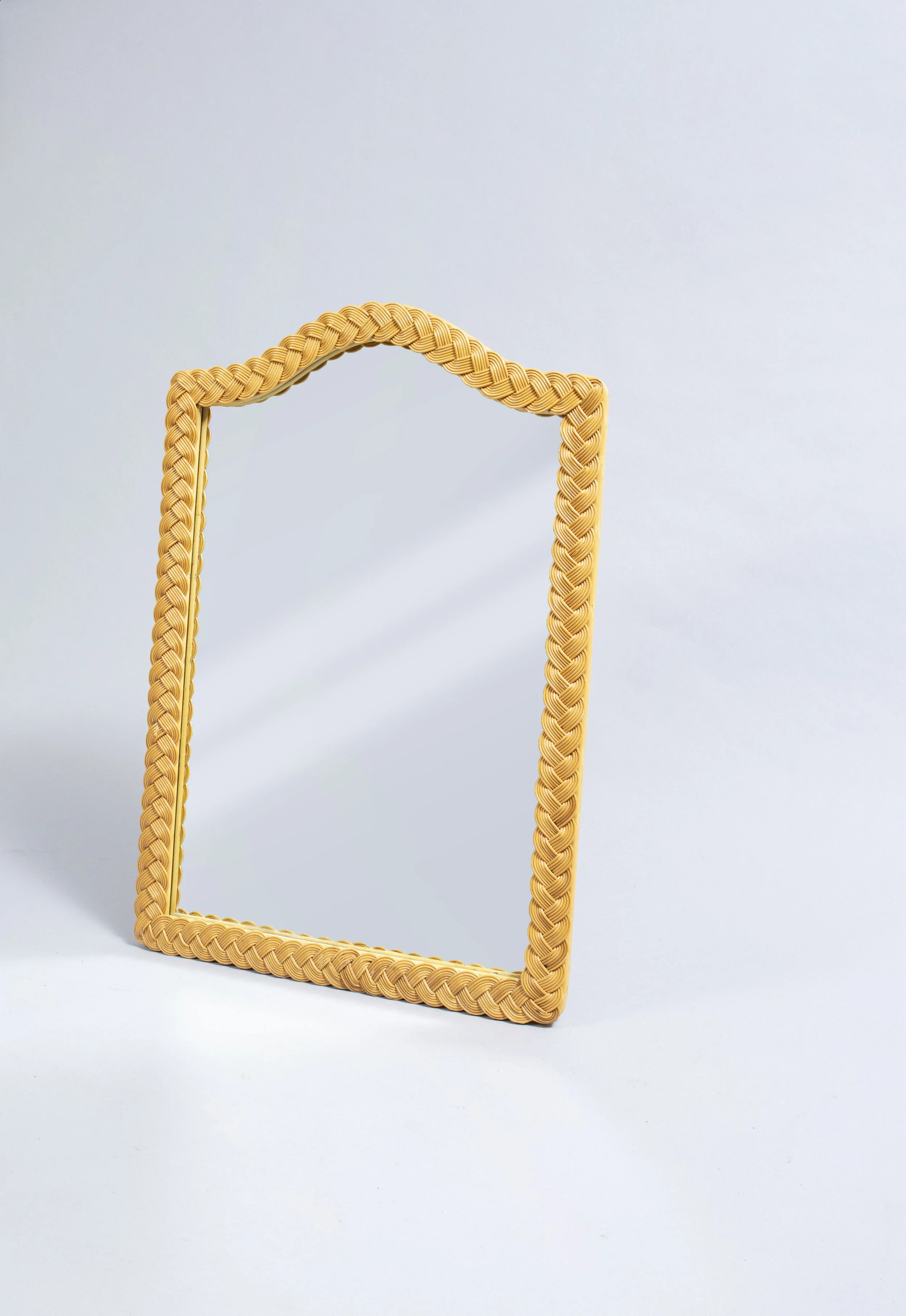 Mirror framed in woven wickerwork.