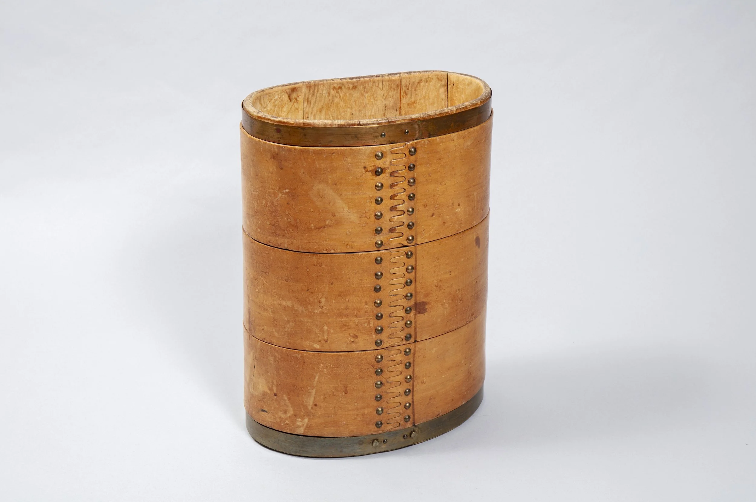 Old wooden basket used to transport cheese down from the mountains. Switzerland, circa 1940.