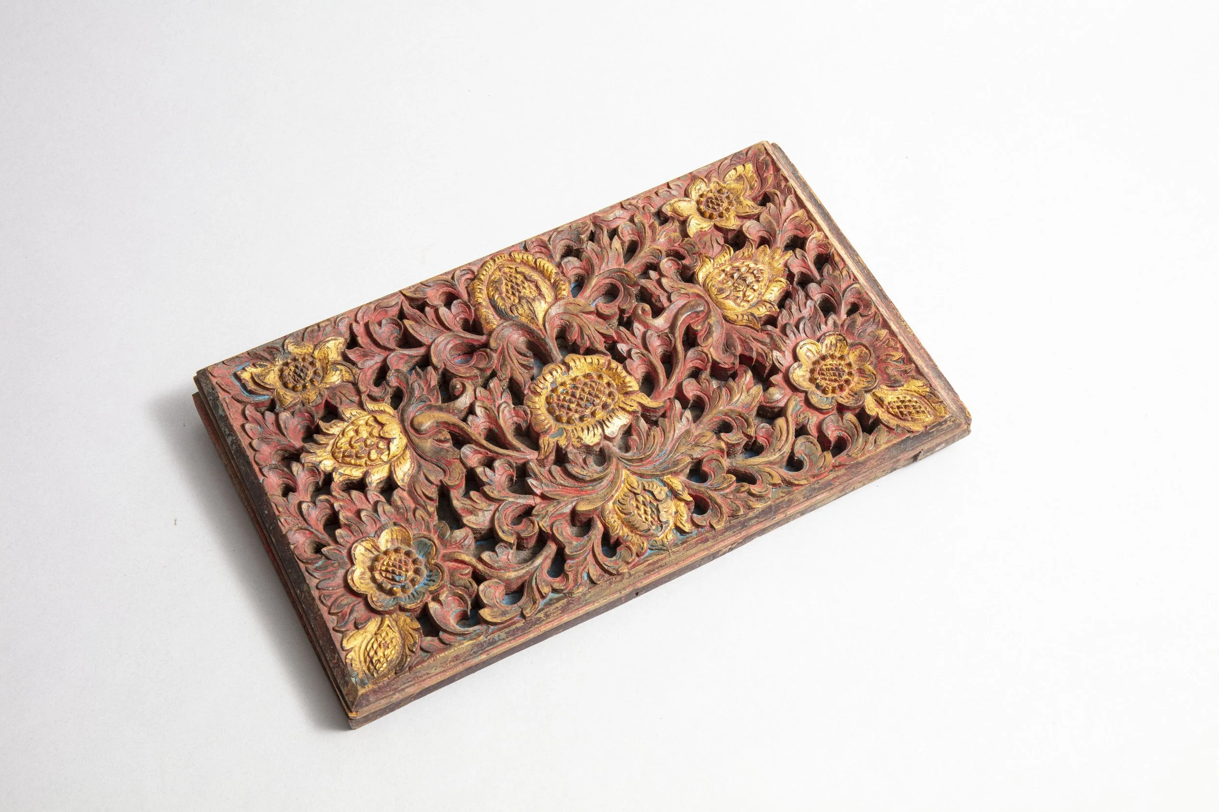 Decorative bas-relief mounted on wood