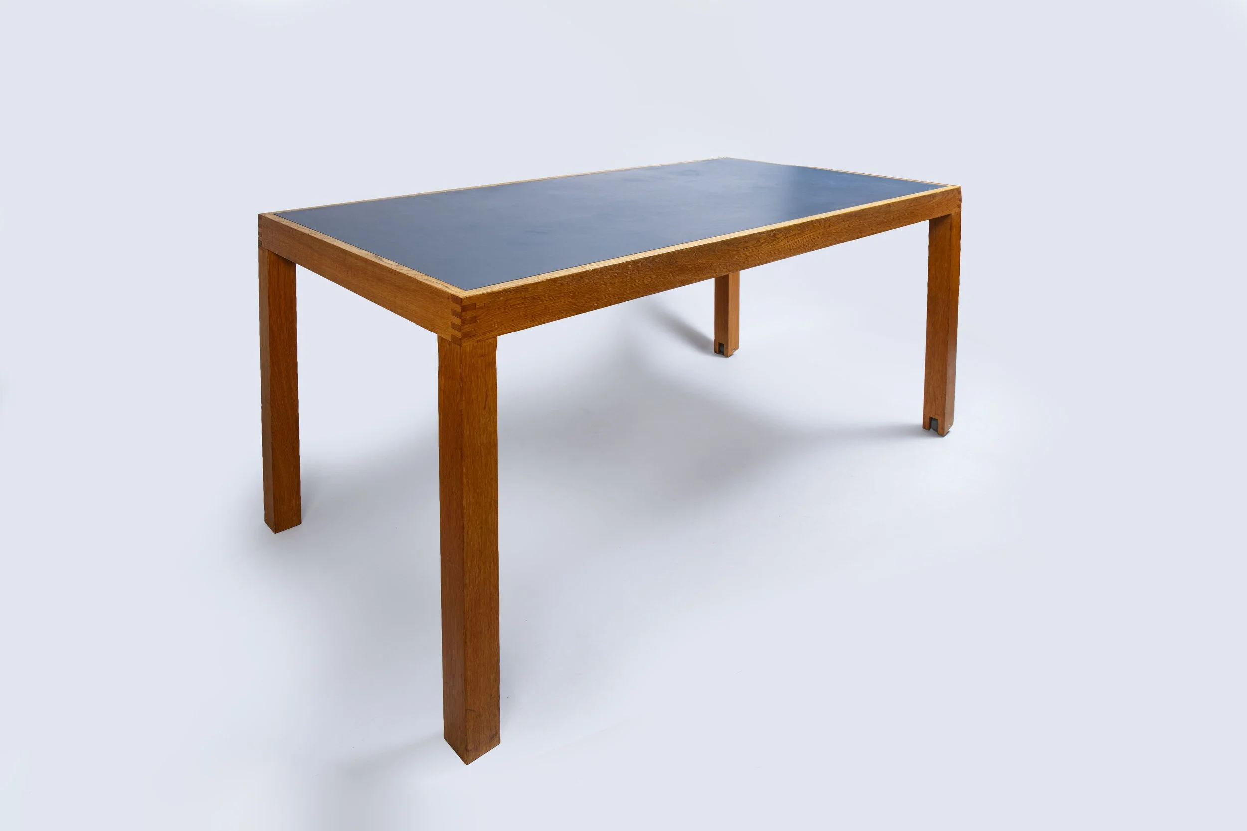 Pine table with a linoleum top.