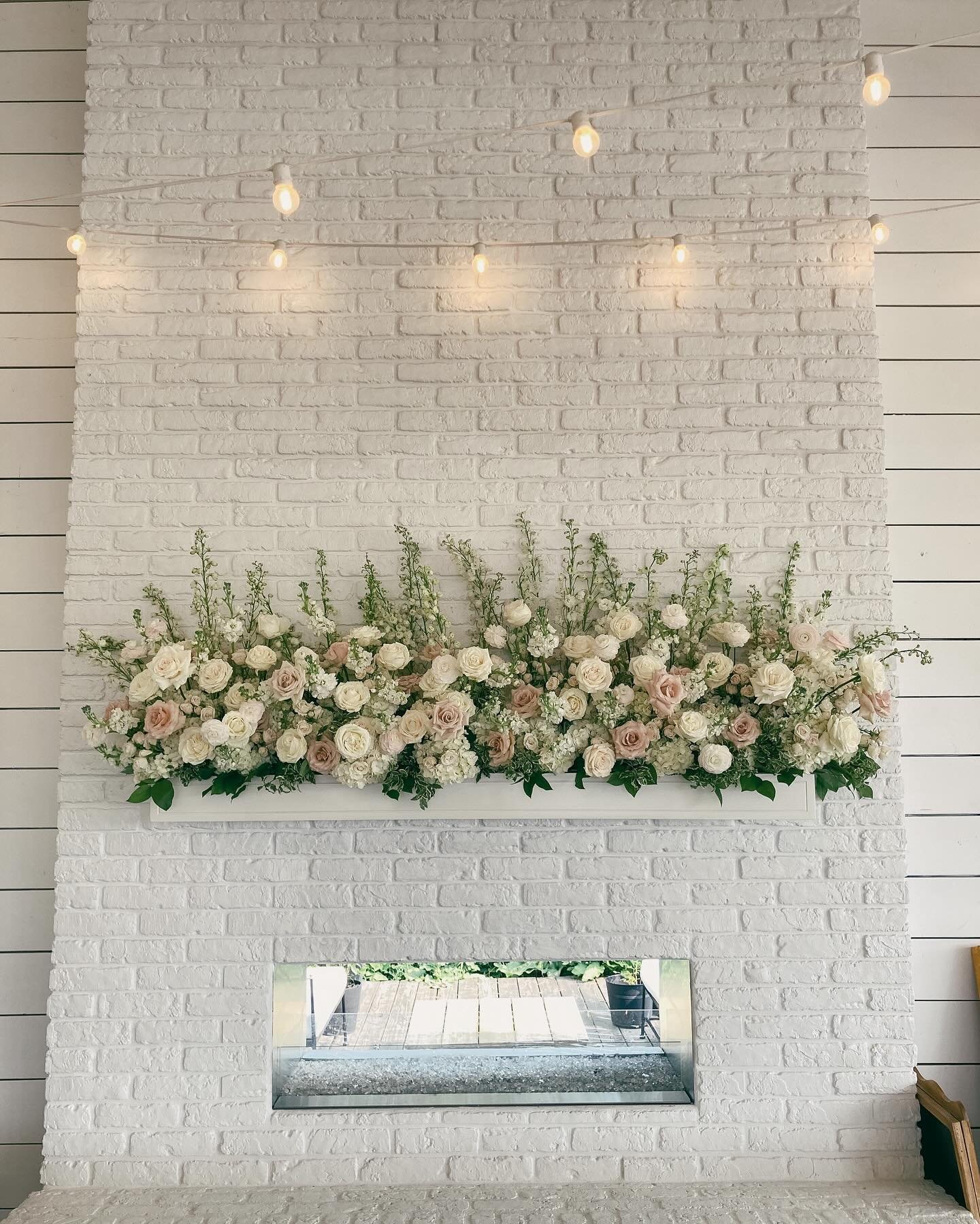 Pretty fireplace mantle flowers are always in style, if you ask me. 

Our new home has a wood burning fireplace and cozy fires have quickly become our nightly ritual after kids are in bed. Might just have to whip us up a pretty installation for the m