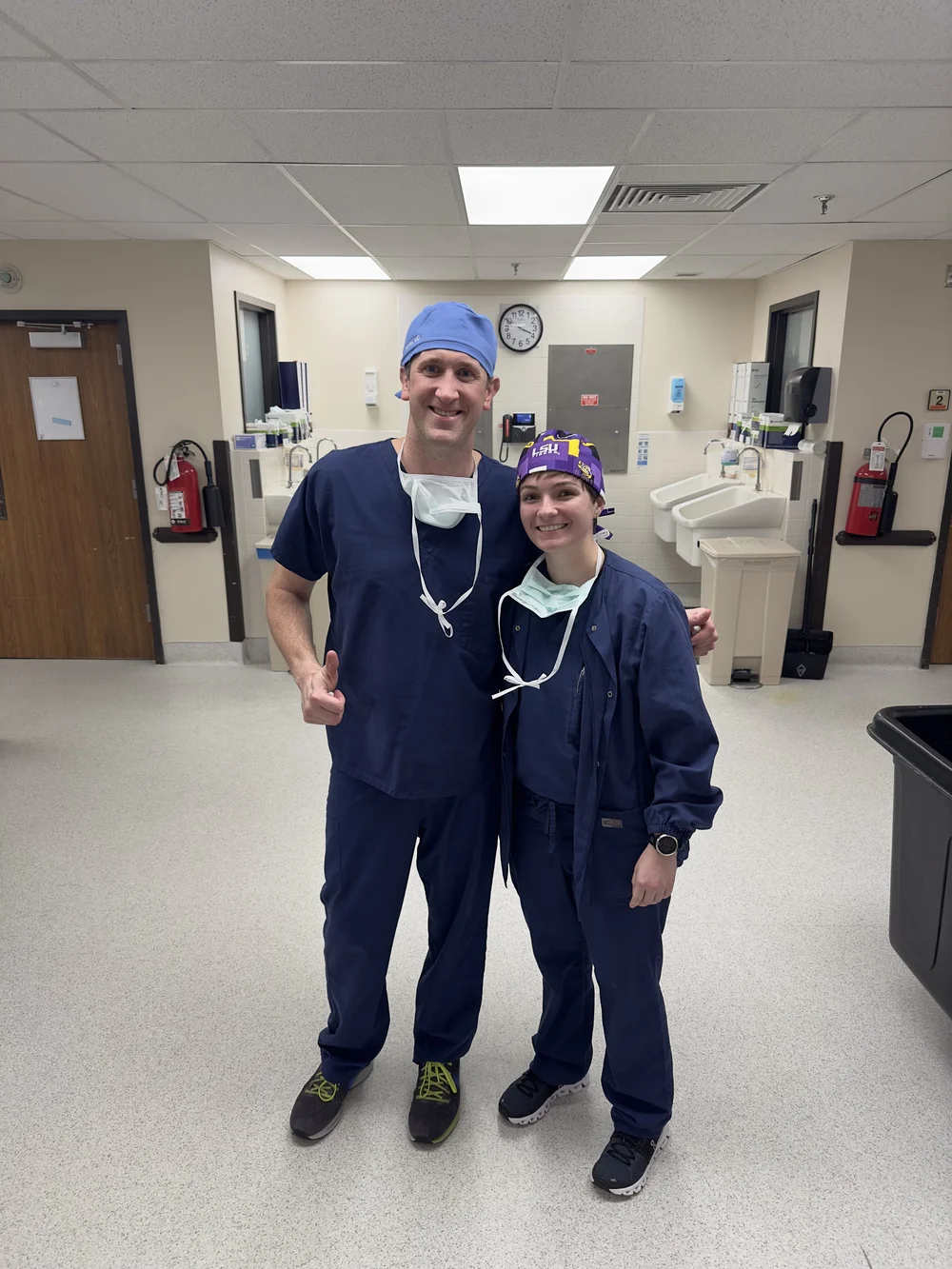 Dr. Justin Haydel MD neurosurgeon neurosurgery Michelle Veillon-Bradshaw medical student medical assistant (MA) navy scrubs LSU Figs scrub cap operating room Ochsner Health Center O'Neal