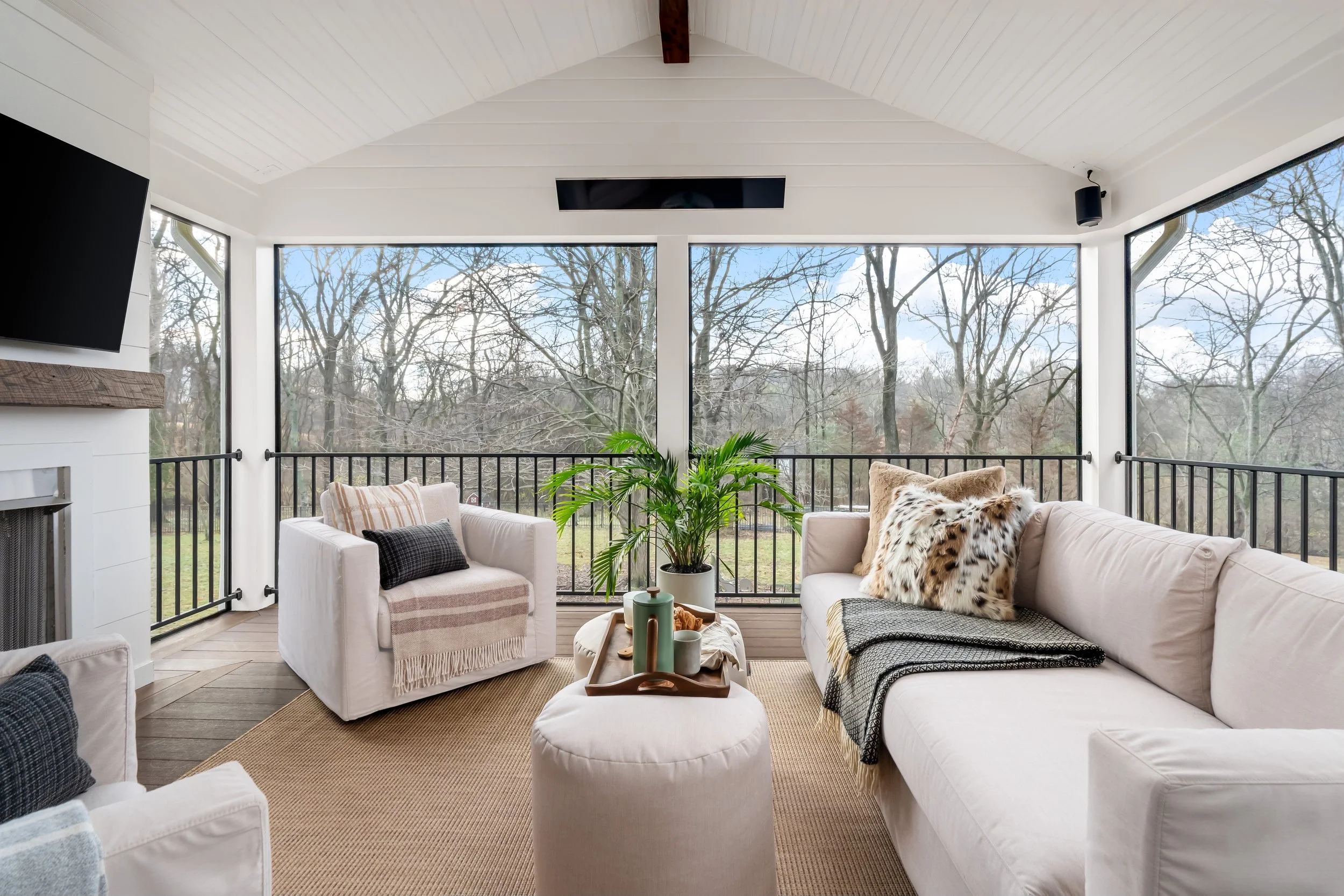 Outdoor slipcovered sofa, chairs and rug.jpeg