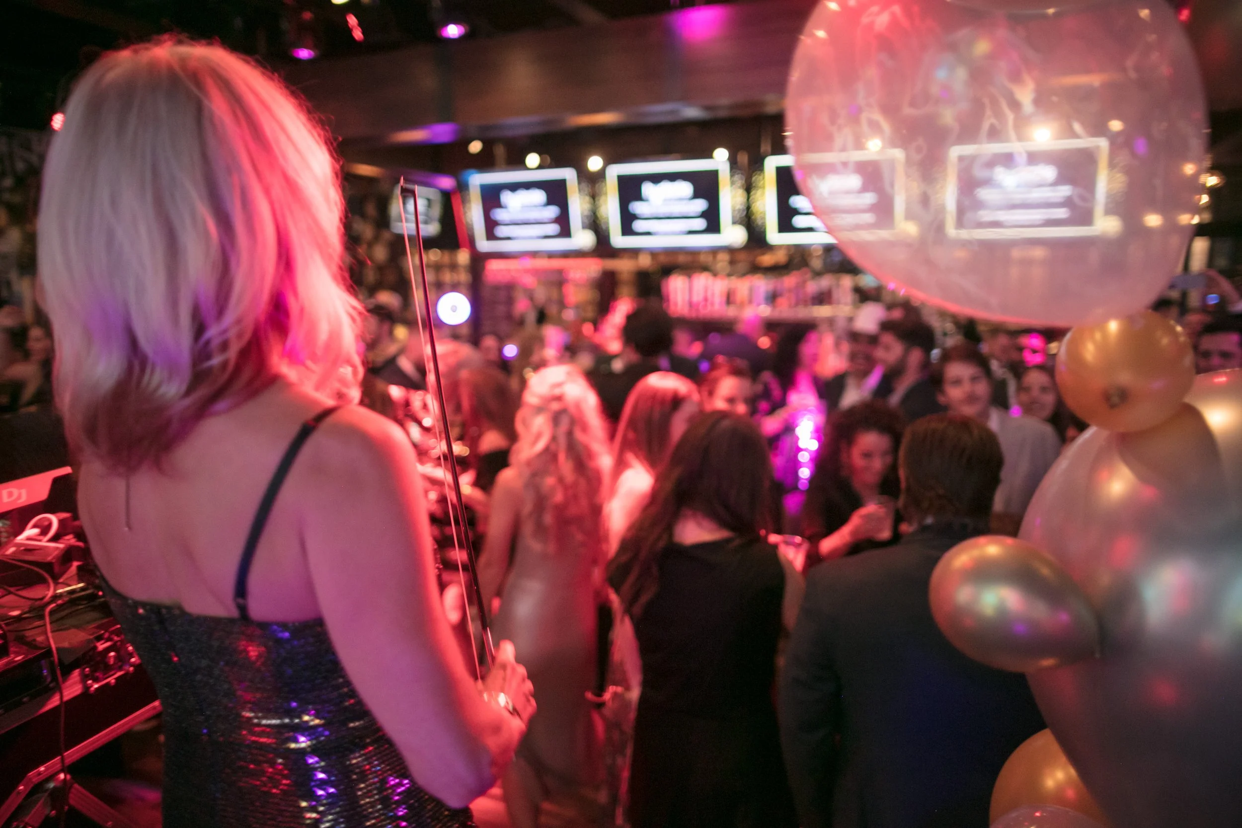 Party on a Tuesday attendee near DJ booth at Colorado Startup Week's annual Denver startup networking celebration