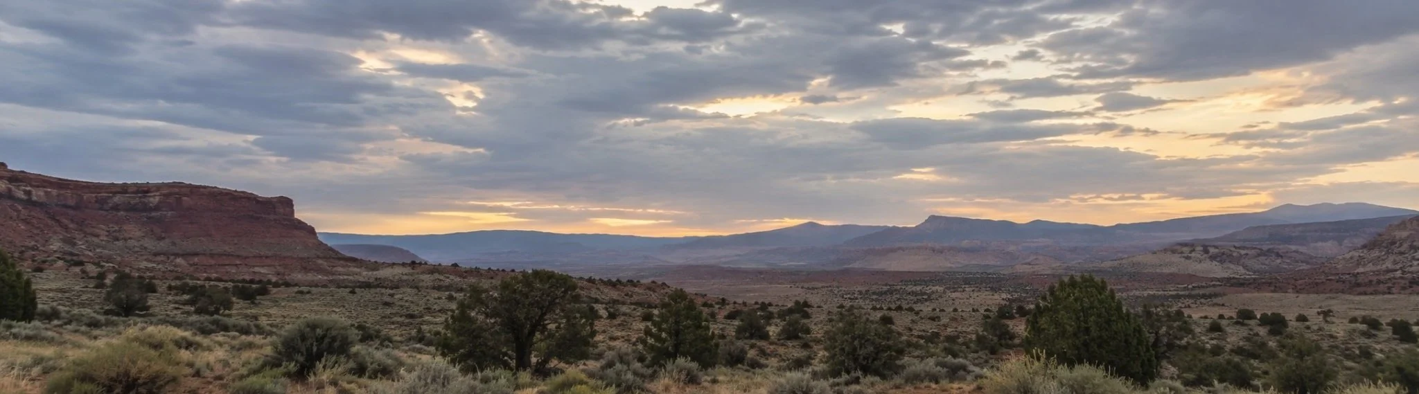 Desert landscape beneath a cloudy sky