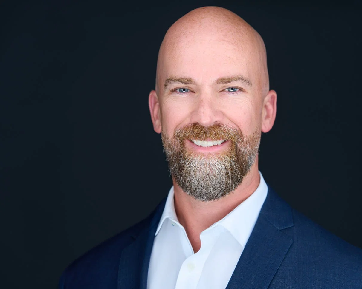 Serious male leader headshot conveying trust and authority - corporate headshots Oakville Brand Savage