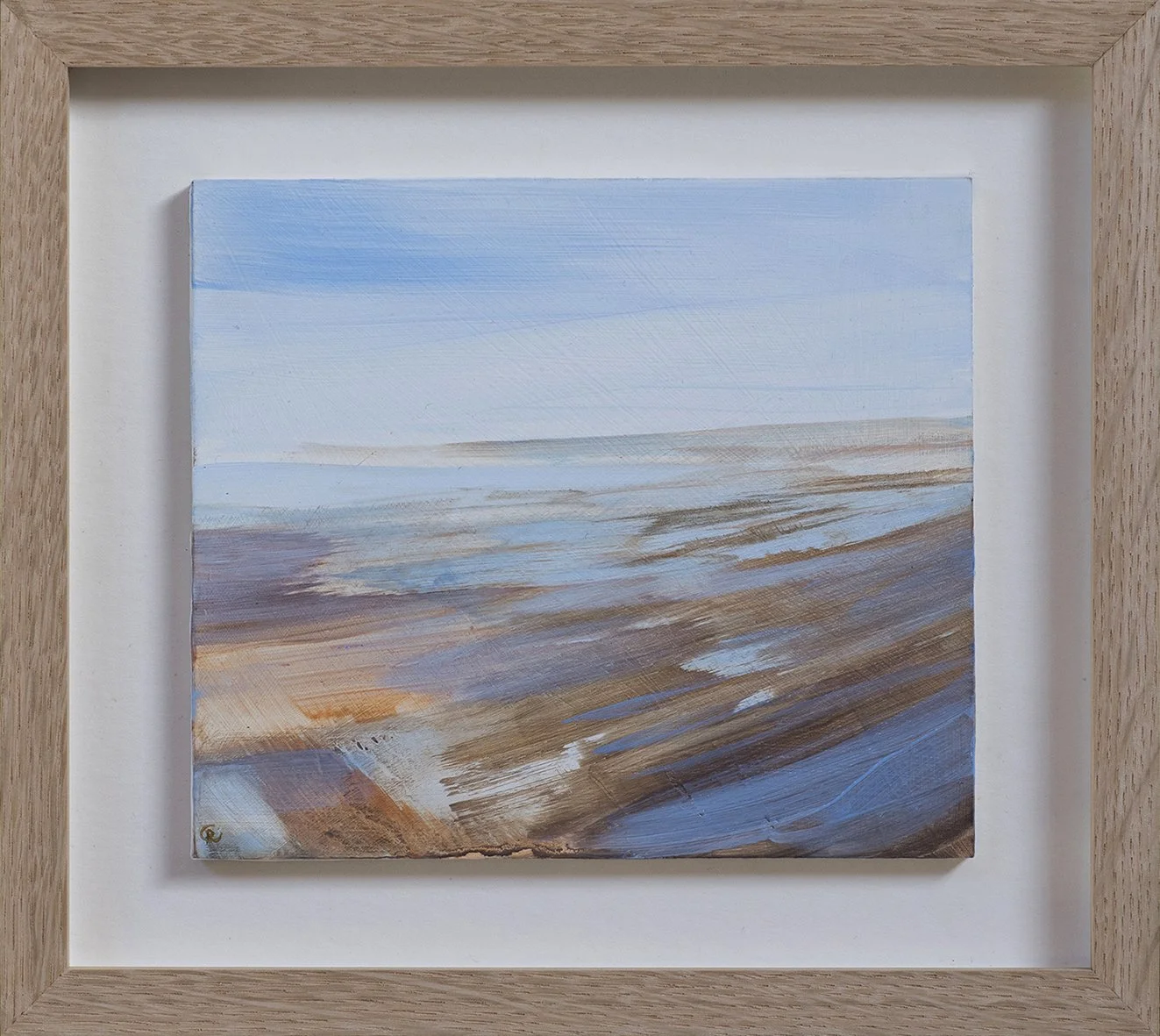 Abstract landscape painting of a beach scene with blue sky, water, and sandy shore within a wooden frame.