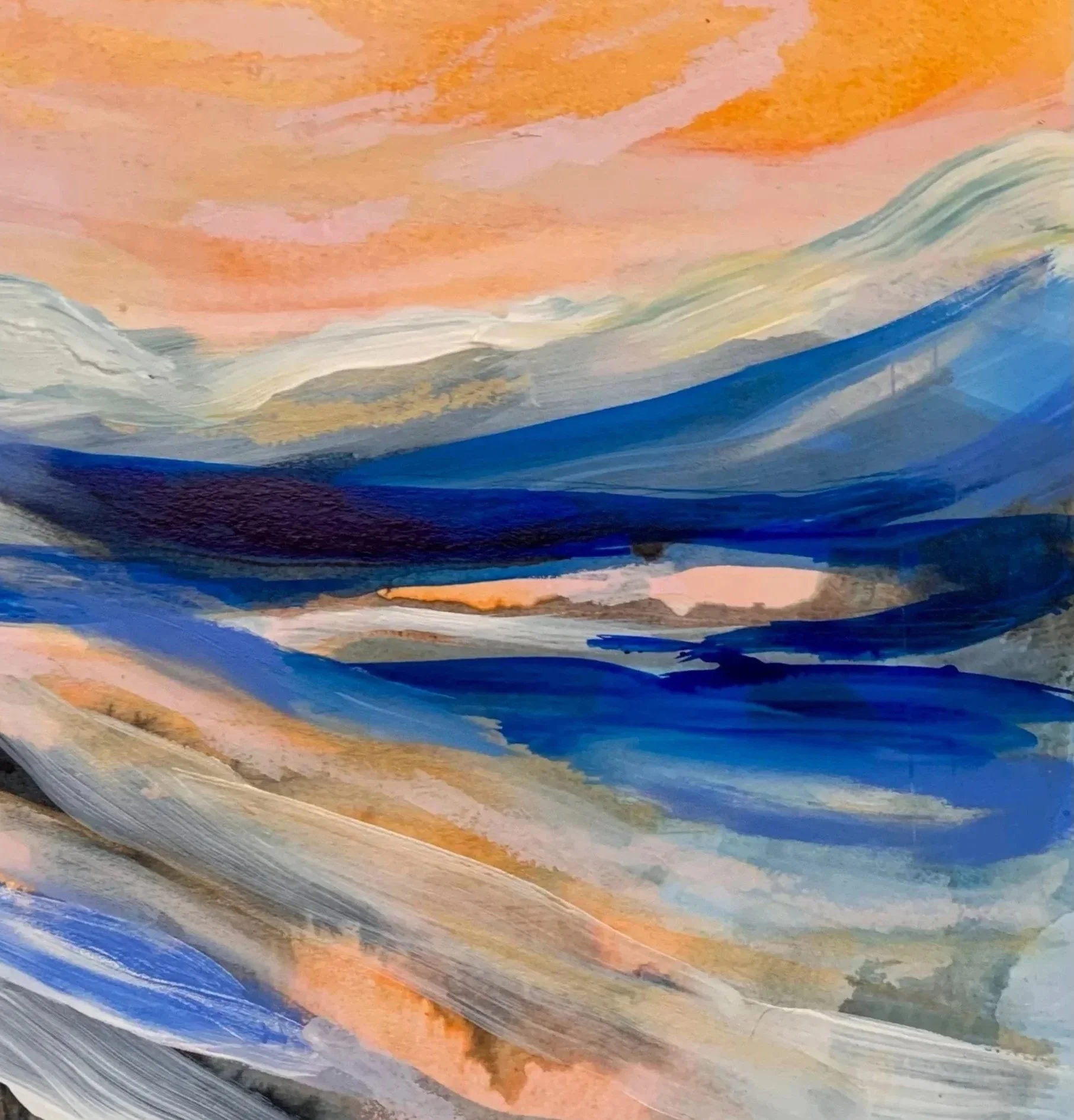 Abstract watercolor painting of a landscape with blue mountains, pink, orange, and gray sky, and sweeping brushstrokes.