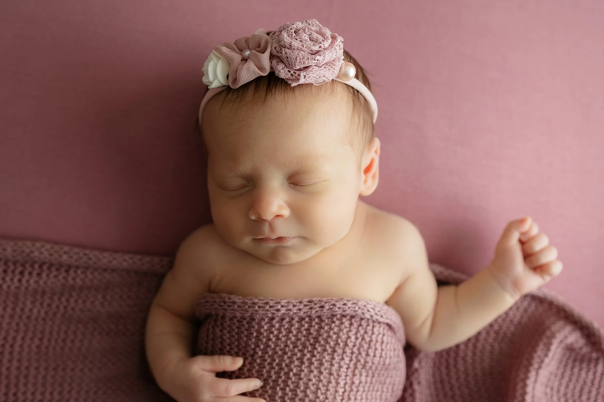 baby girl posing for photo