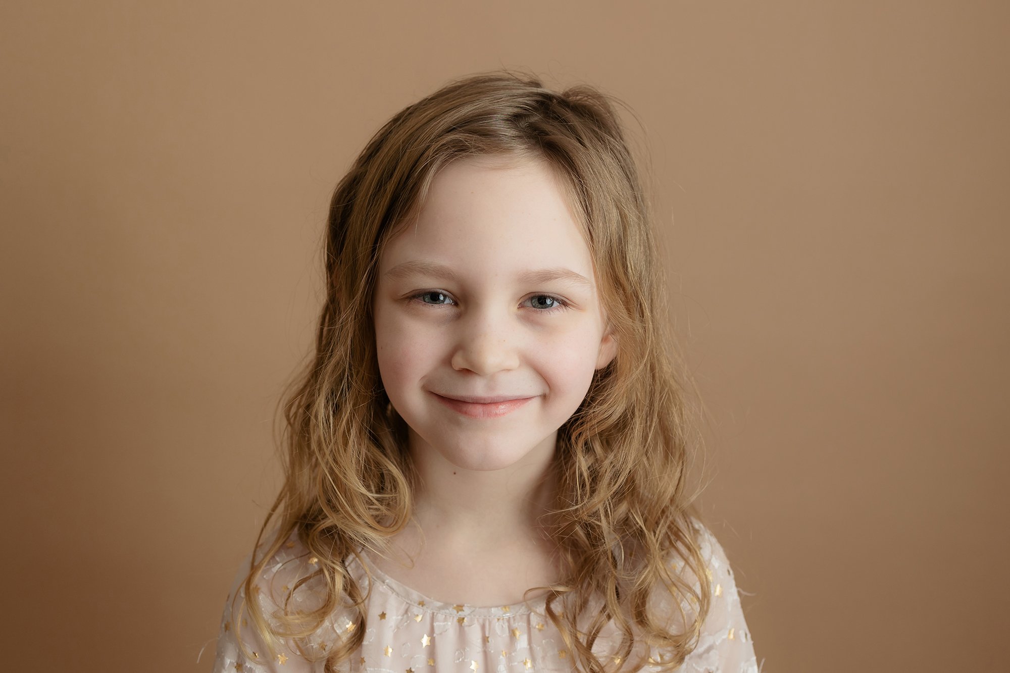 Child posing for her studio portrait session in my northern Virginia studio.