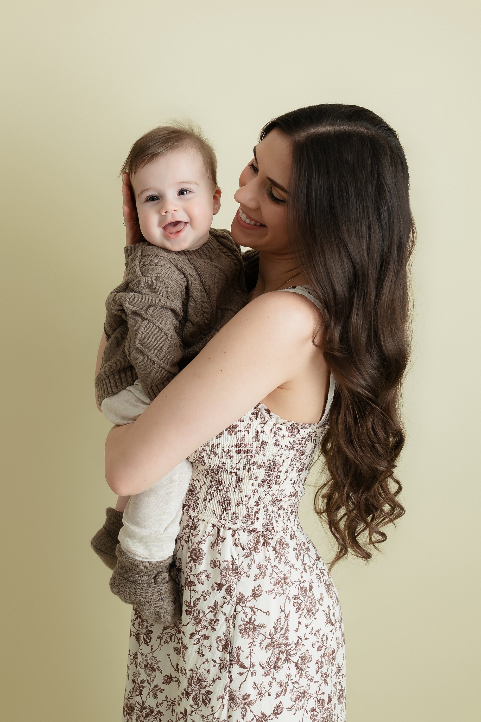 Candid family moment captured in the studio, showcasing love and connection in a clean, uncluttered environment.