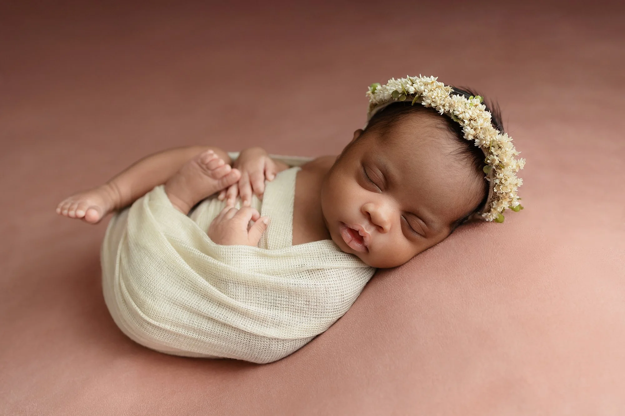 Northern va Newborn baby sleeping soundly in a cozy swaddle.