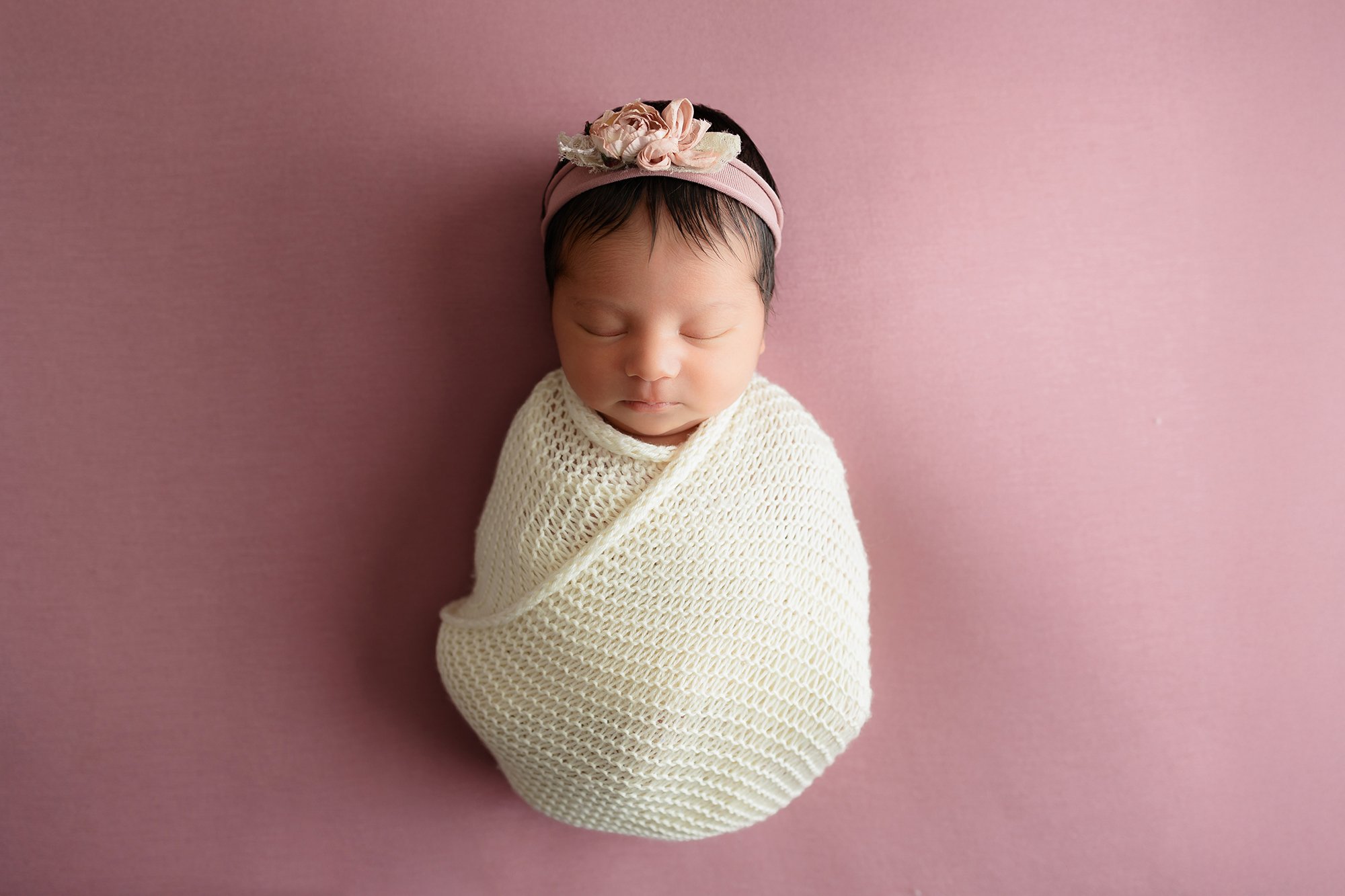 Baby girl posing nicely wrapped in my Manassas, Virginia studio.