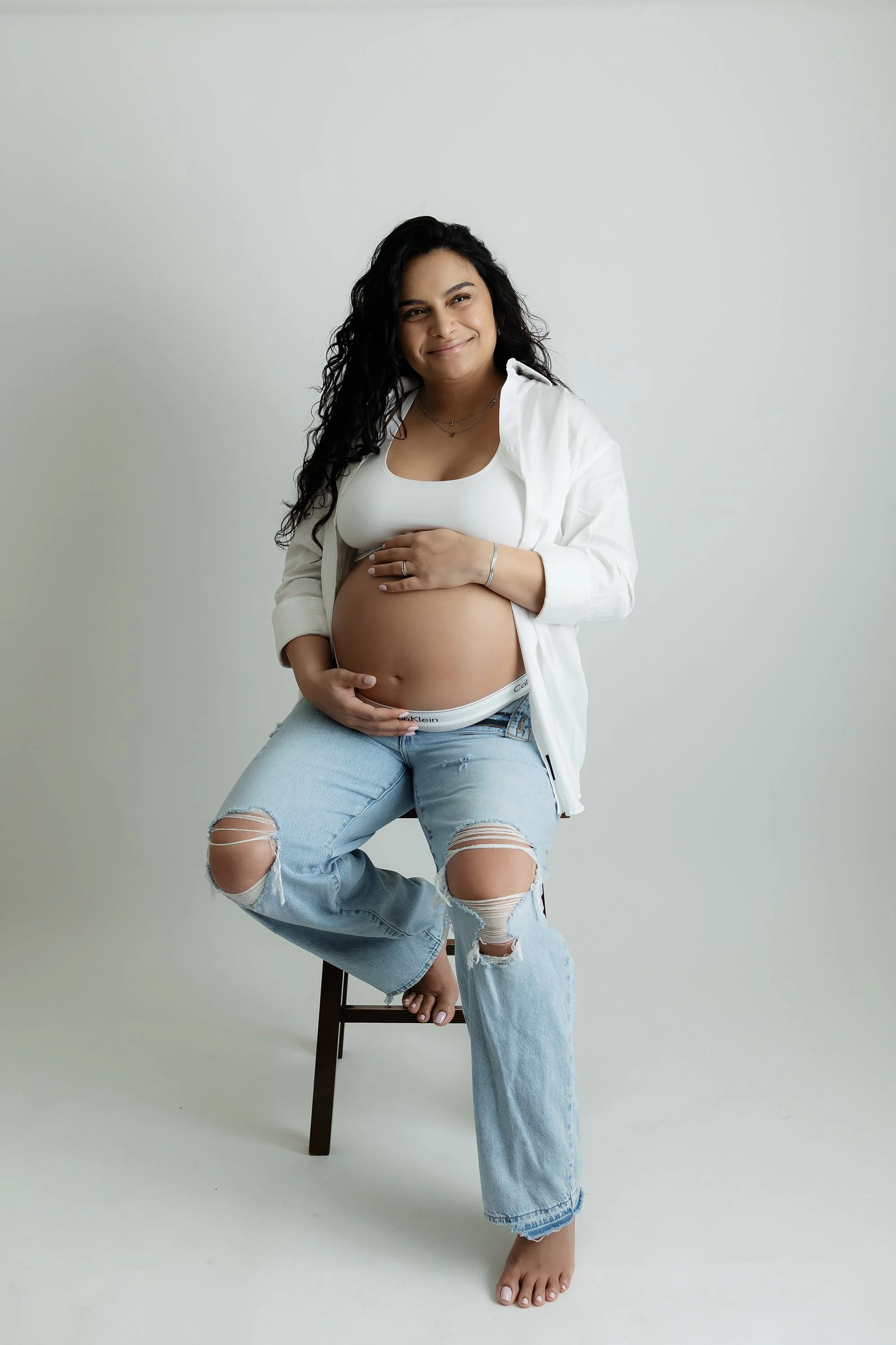 Studio maternity portrait of a pregnant woman by RA Photography, the leading maternity photographer in Washington, DC