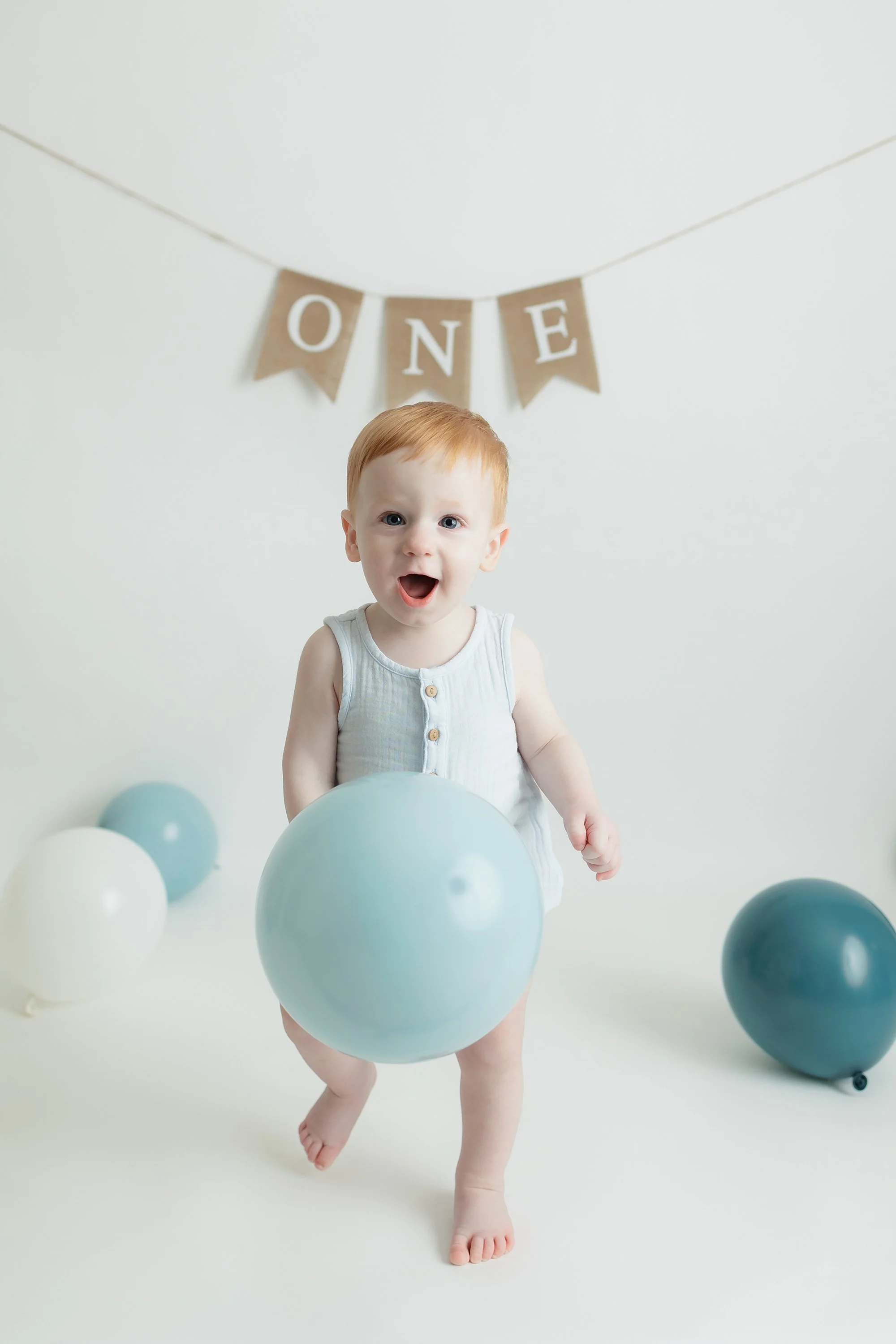 A joyful one-year milestone capture with soft balloons, sweet smiles, and timeless details.