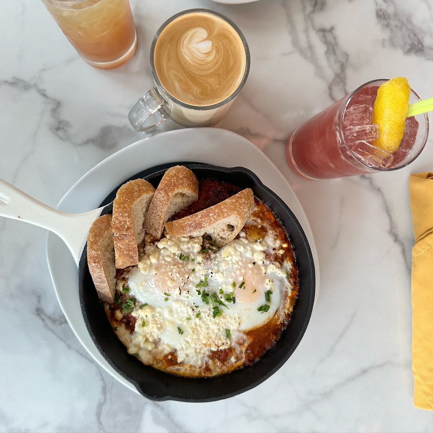 So delicious and warming, our shakshouka will chase the winter chill away. Shakshouka is a dish of eggs poached in a rich sauce of onions, peppers, tomatoes and spices! 
Serving brunch till 3 pm! 

#boozybrunch #downtownmissoula #shakshouka #latte #c
