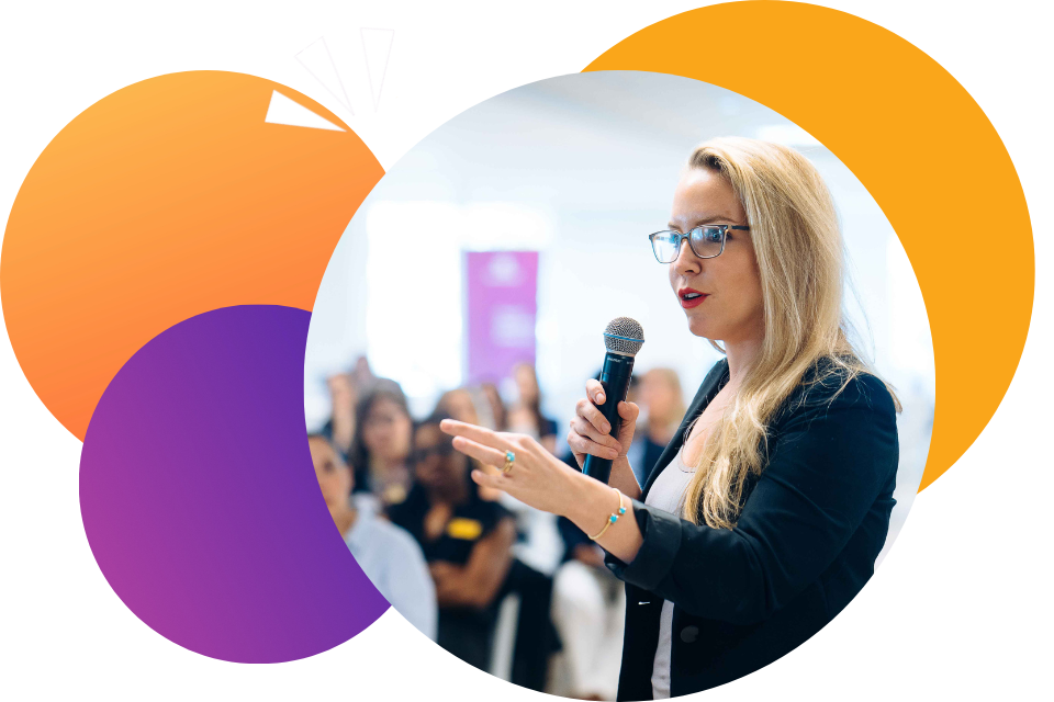 A WeSpeak Coach confidently speaking with a microphone