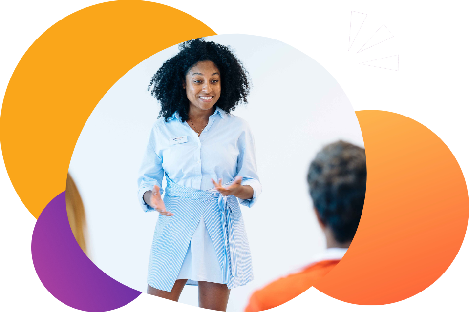 A woman learning how to public speak in front of an audience