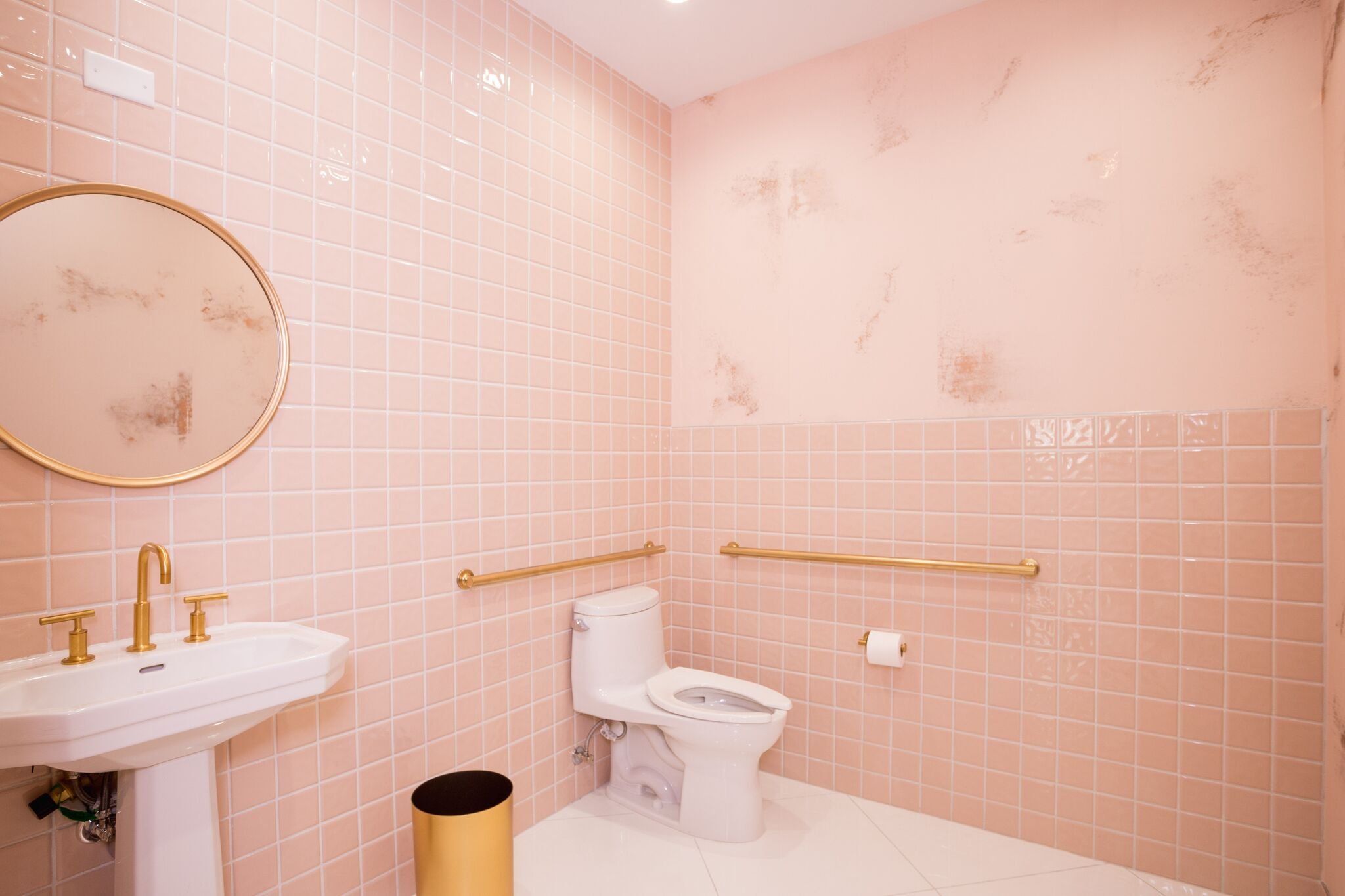 Pink-tile-restroom-with-gold-accents.jpeg