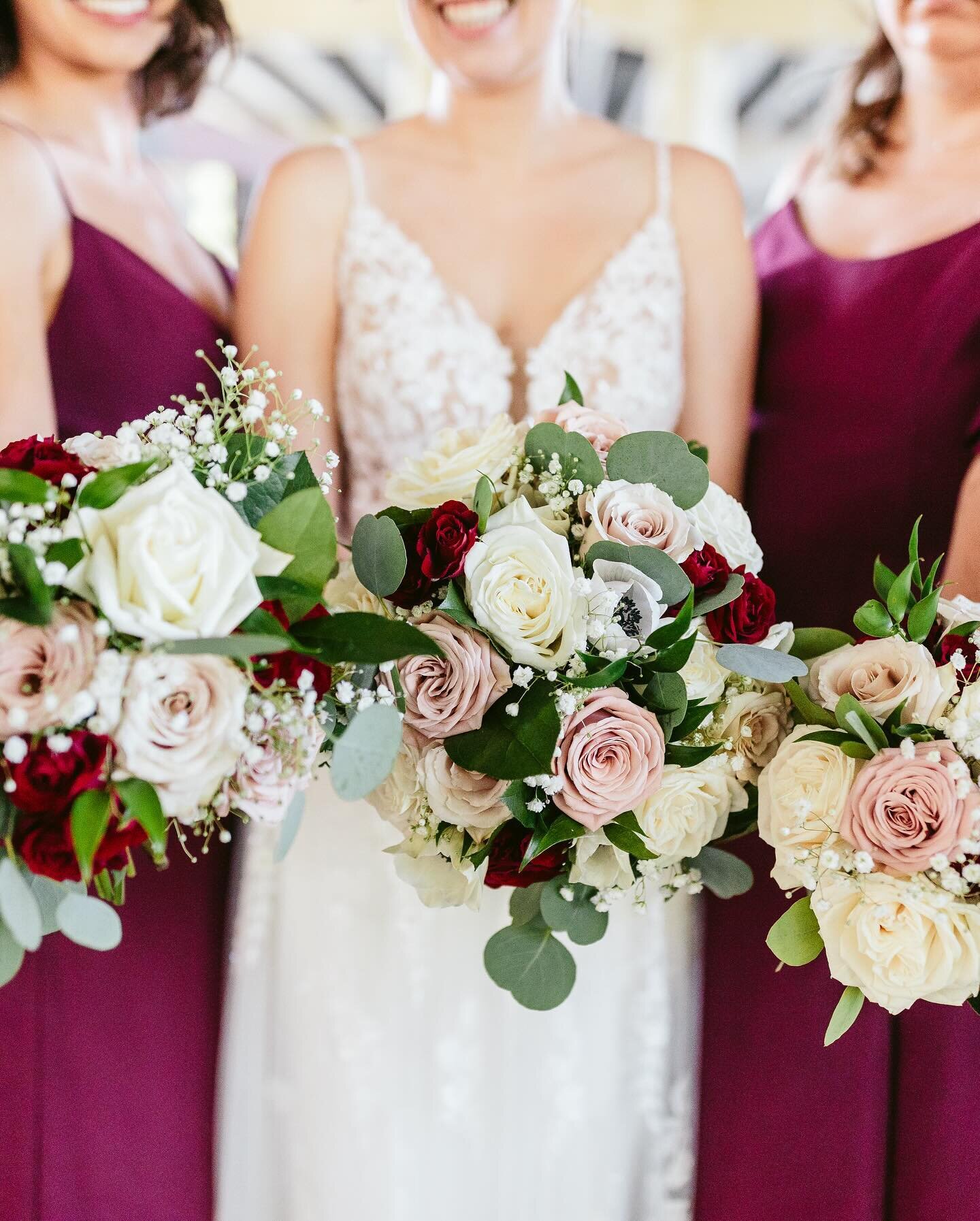 Loved the pops of colors that these beautiful bouquets brought and how well they complemented the bridesmaids dresses! A loose round bouquet of creamy white roses, babies breath, burgundy spray roses, cappuccino and quicksand roses based lightly with