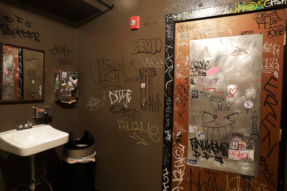 The graffiti-covered walls of Pel’meni’s bathroom