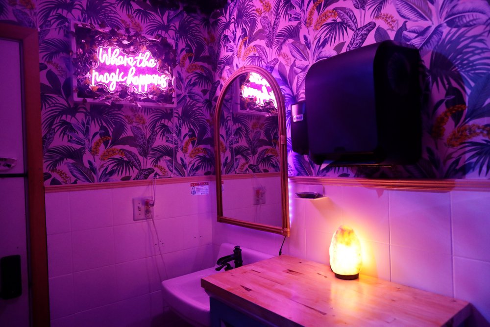 The sink and colorful walls of Sweet As Waffles’ bathroom
