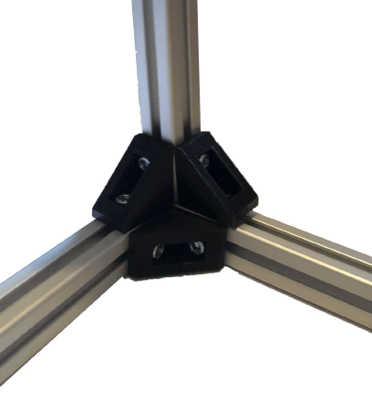 Frame construction - the aluminium extrusion was cut to the correct length then joined using triangular corner brackets. The axis attachments were also inserted here.